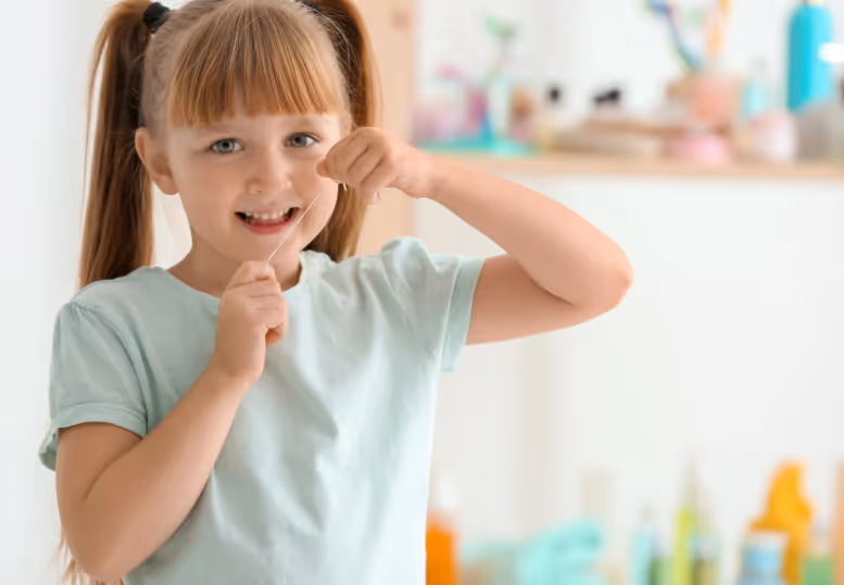 Young girl flossing