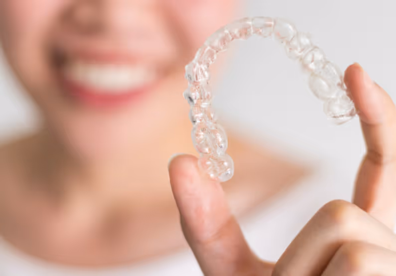 Woman holding Invisalign