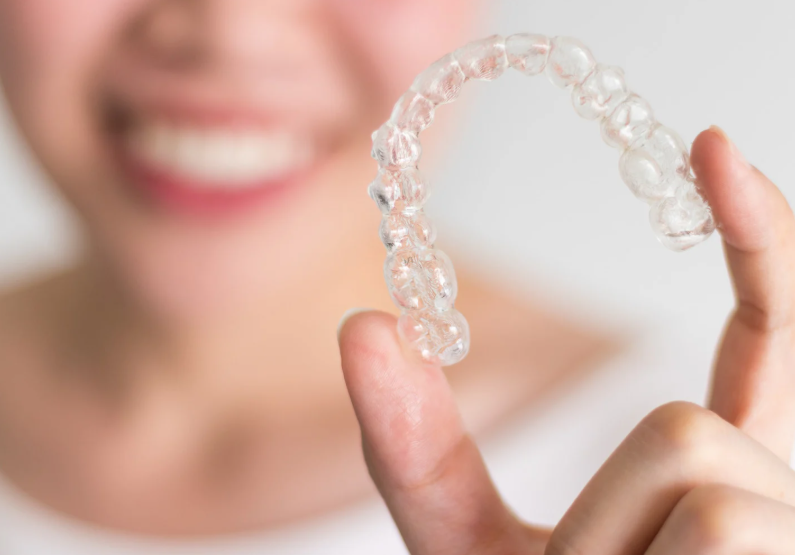 Woman holding Invisalign