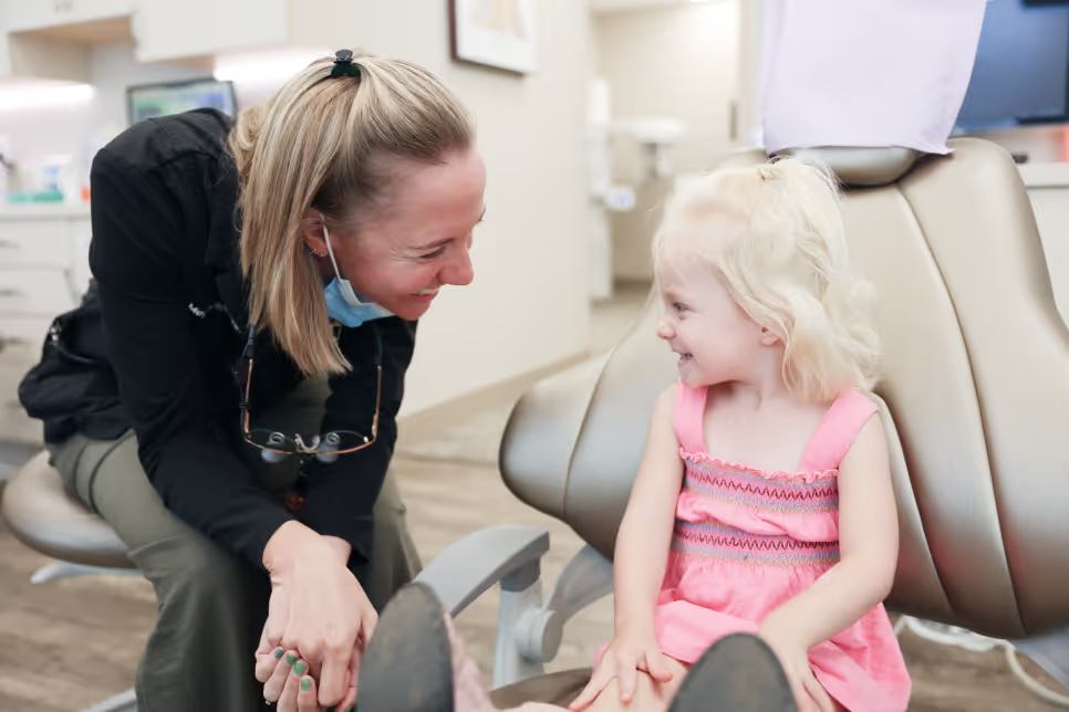 Pediatric dentist with young patient