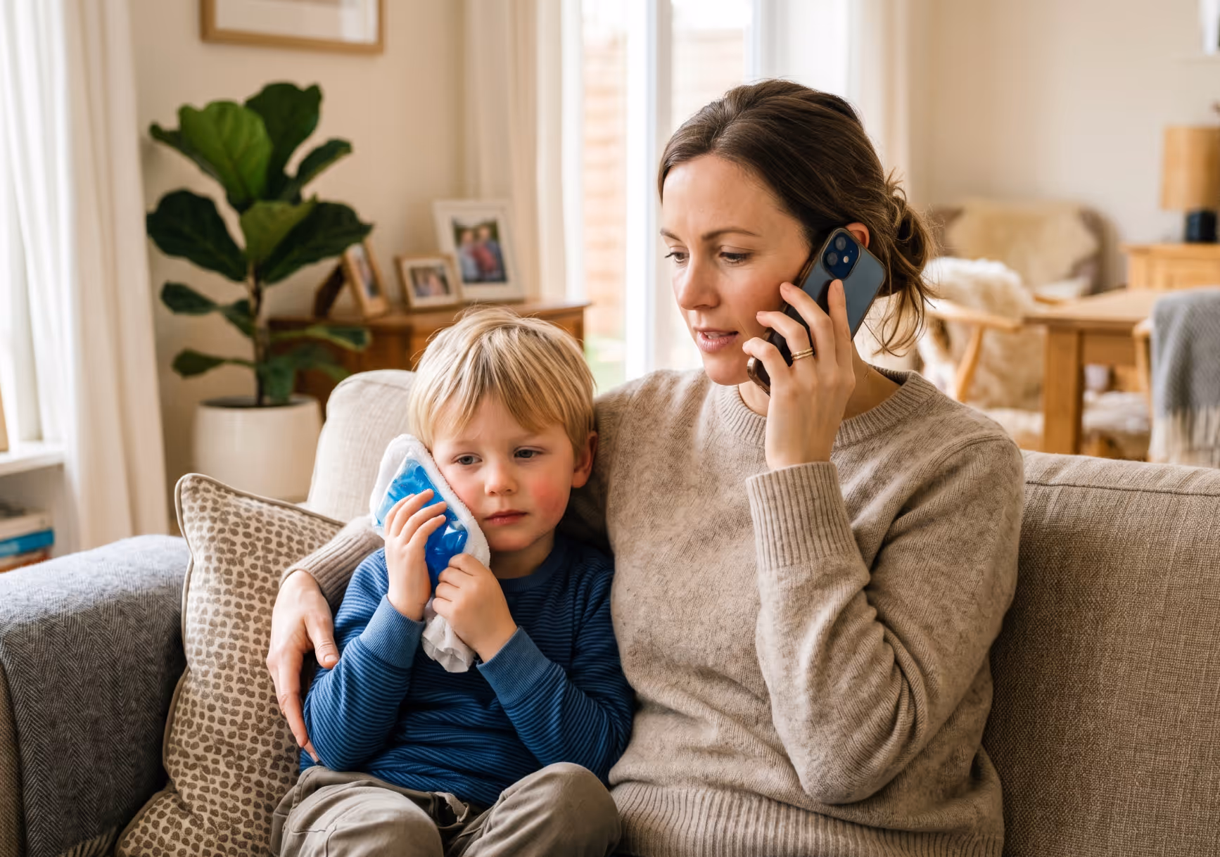 Child with icepack on cheek