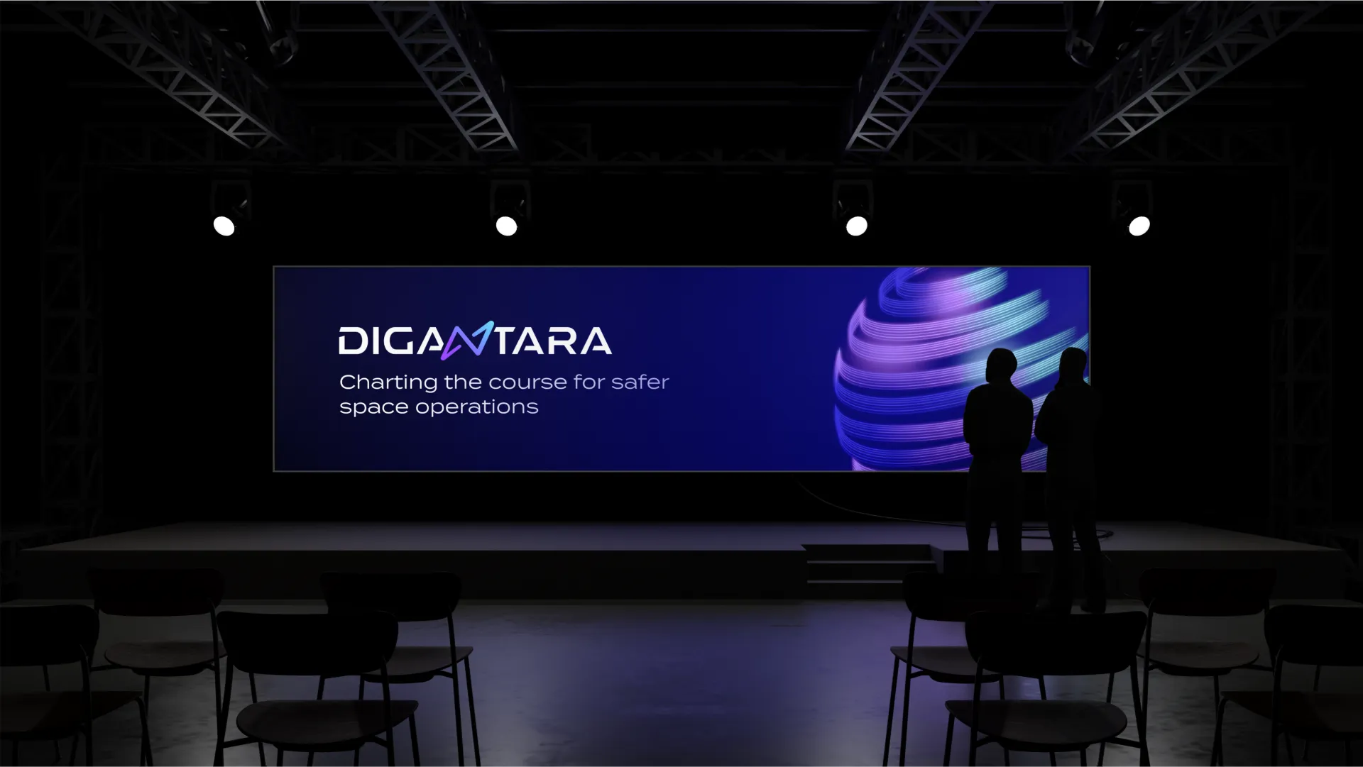 Two men watching an event stage featuring Digantara branding in a theatre setup.