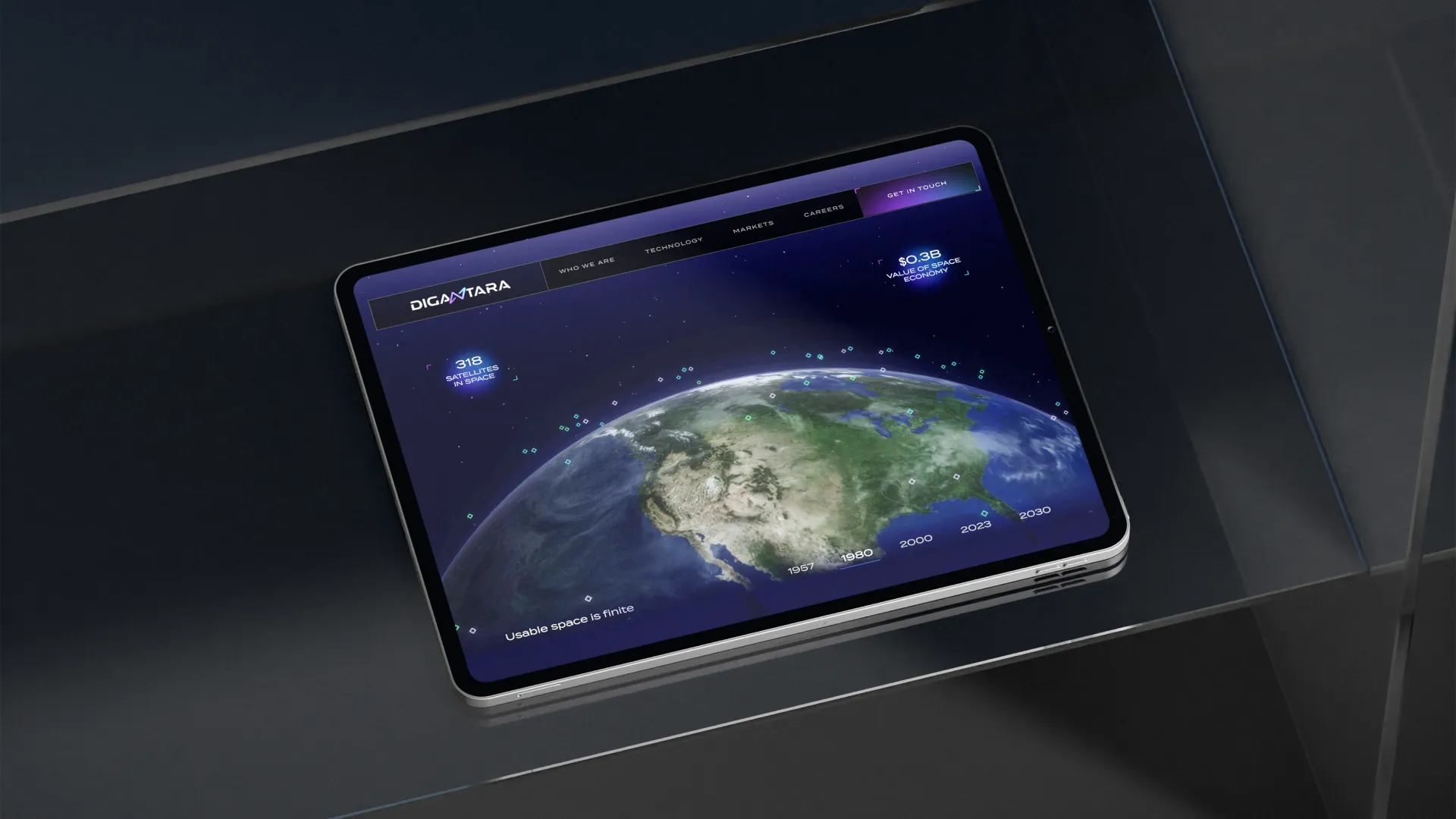 iPad on a modern desk showcasing Digantara's 3D interactive website.