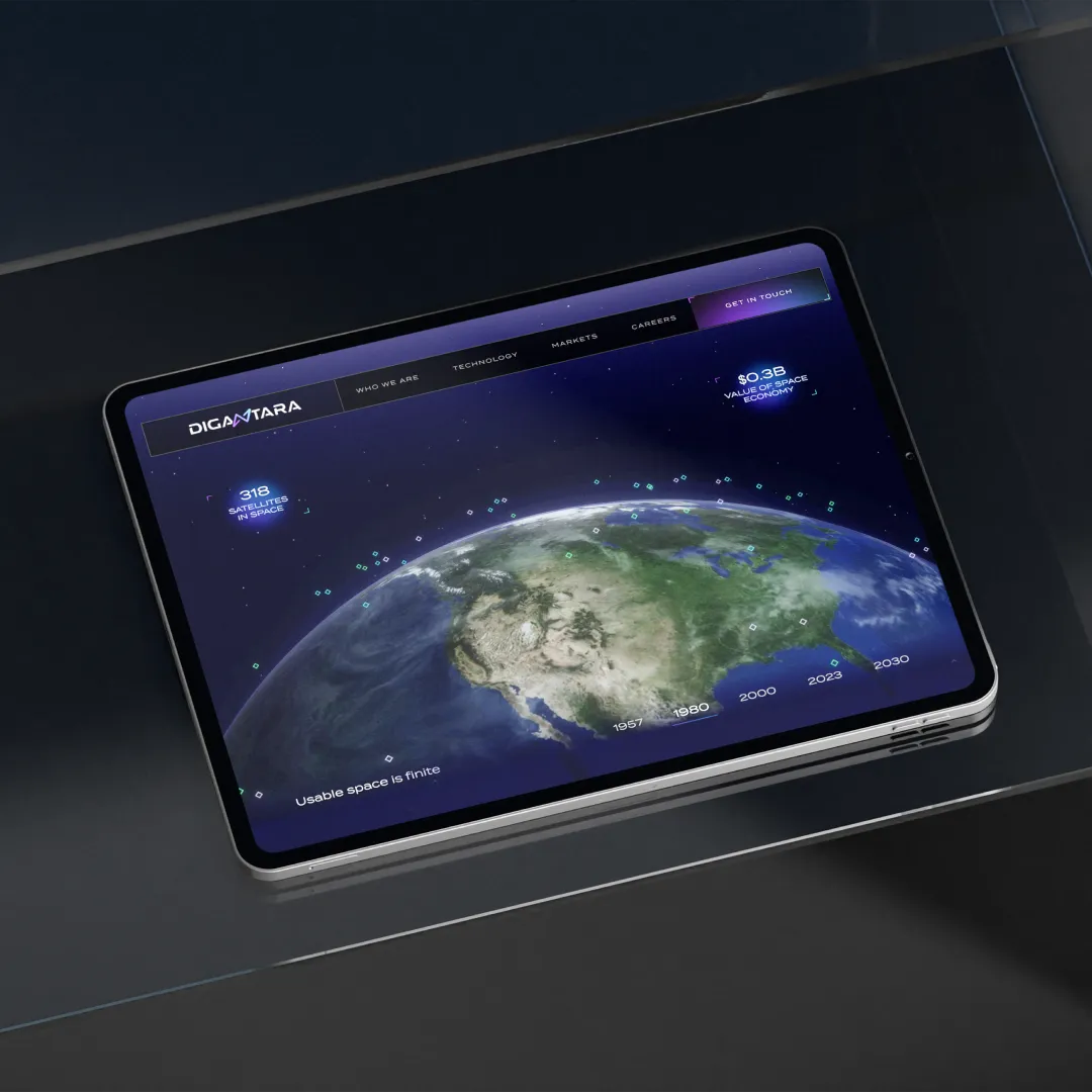 iPad on a modern desk showcasing Digantara's 3D interactive website.