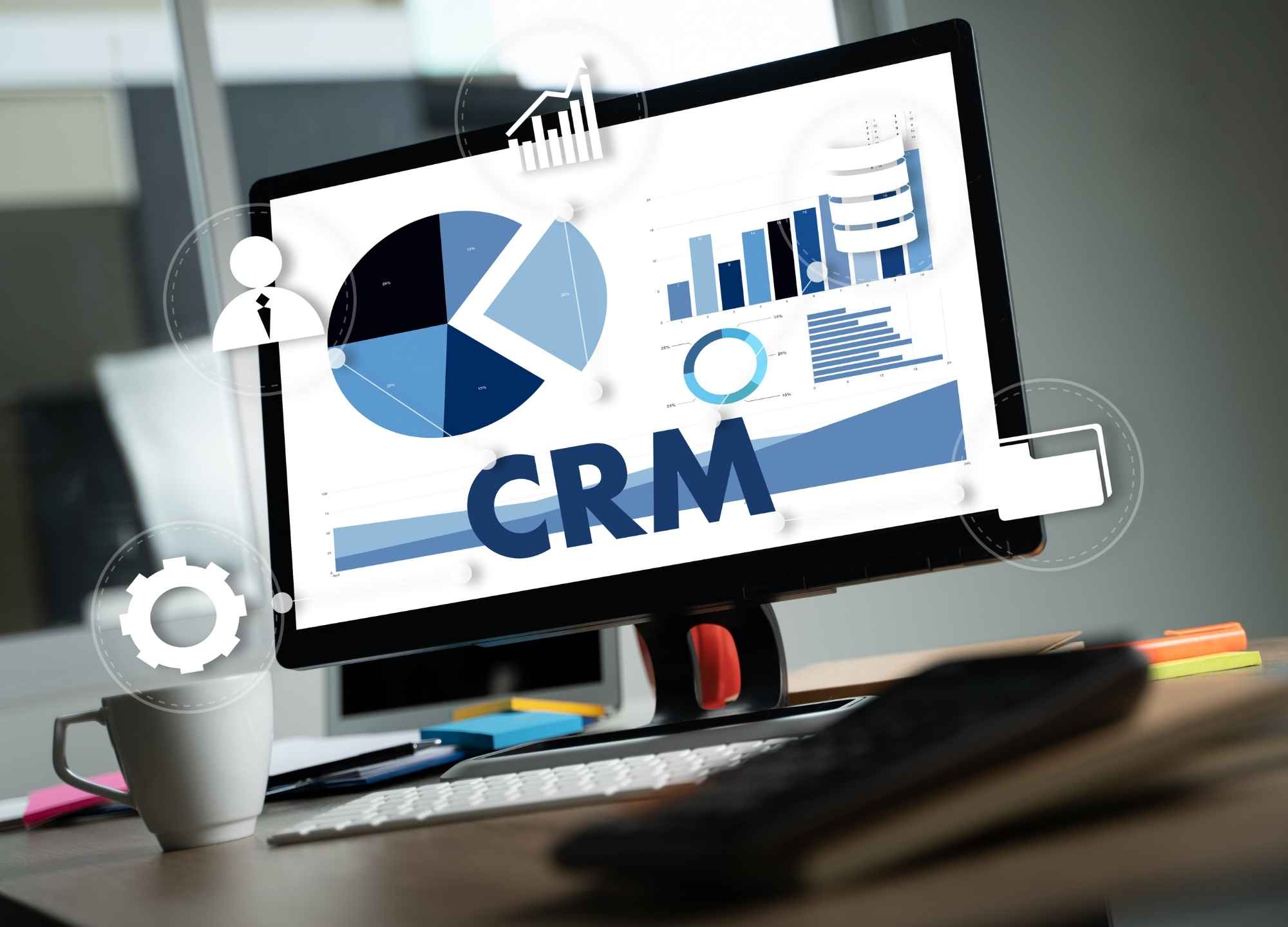 Tela de computador com gráficos de CRM mostrando dados de vendas e automação comercial