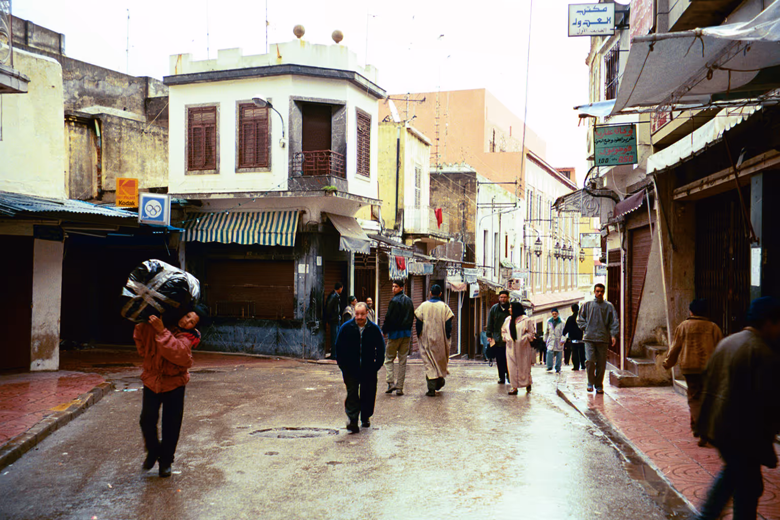 Older Asian street with people walking