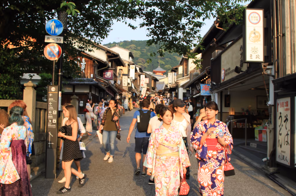 Many people walking down Asian street