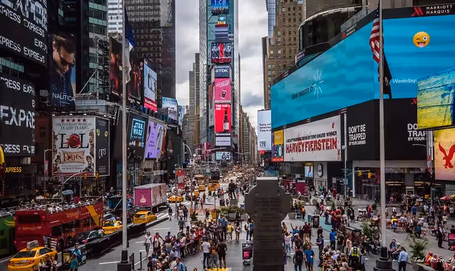 Busy street with many screens in New York City in 2016