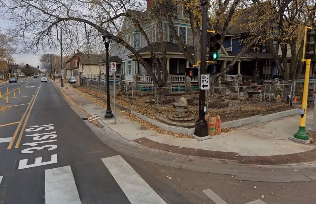 Intersection corner with narrow sidewalks and many obstructions