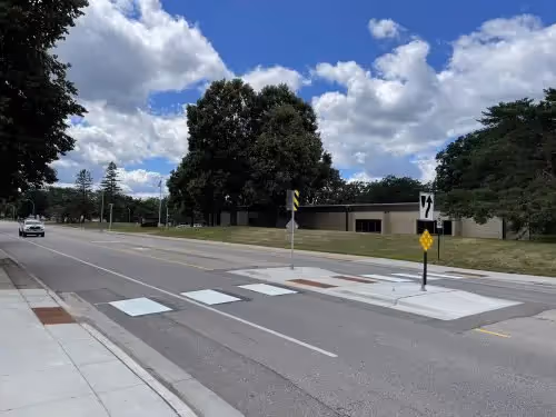 Pedestrian crossing over wide road