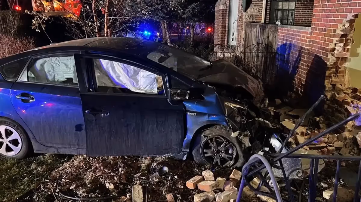 Another car with airbags deployed and hole in the wall