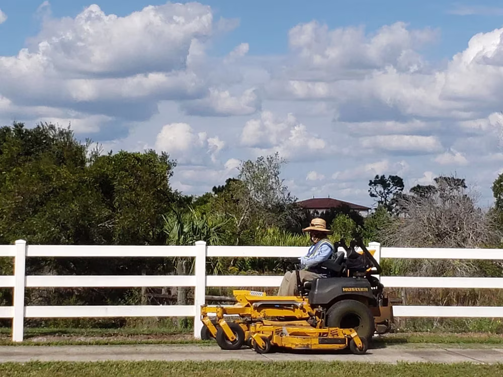 Man driving a lawn mower