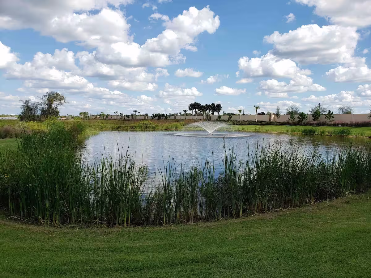 Fountain in the middle of a lake surrounded by nothing