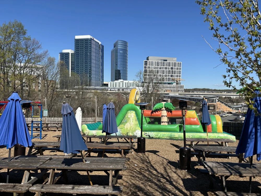 Bouncy castle and picnic tables. (Happy Cities)