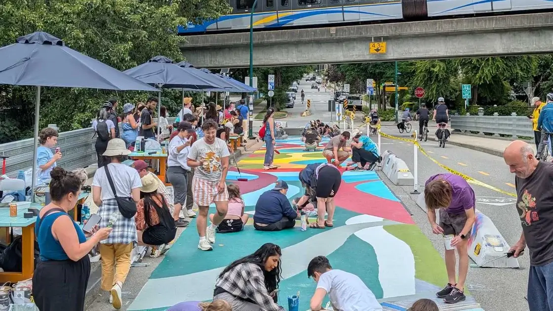 People participating in the neighbourhood paint day on Woodland Bridge