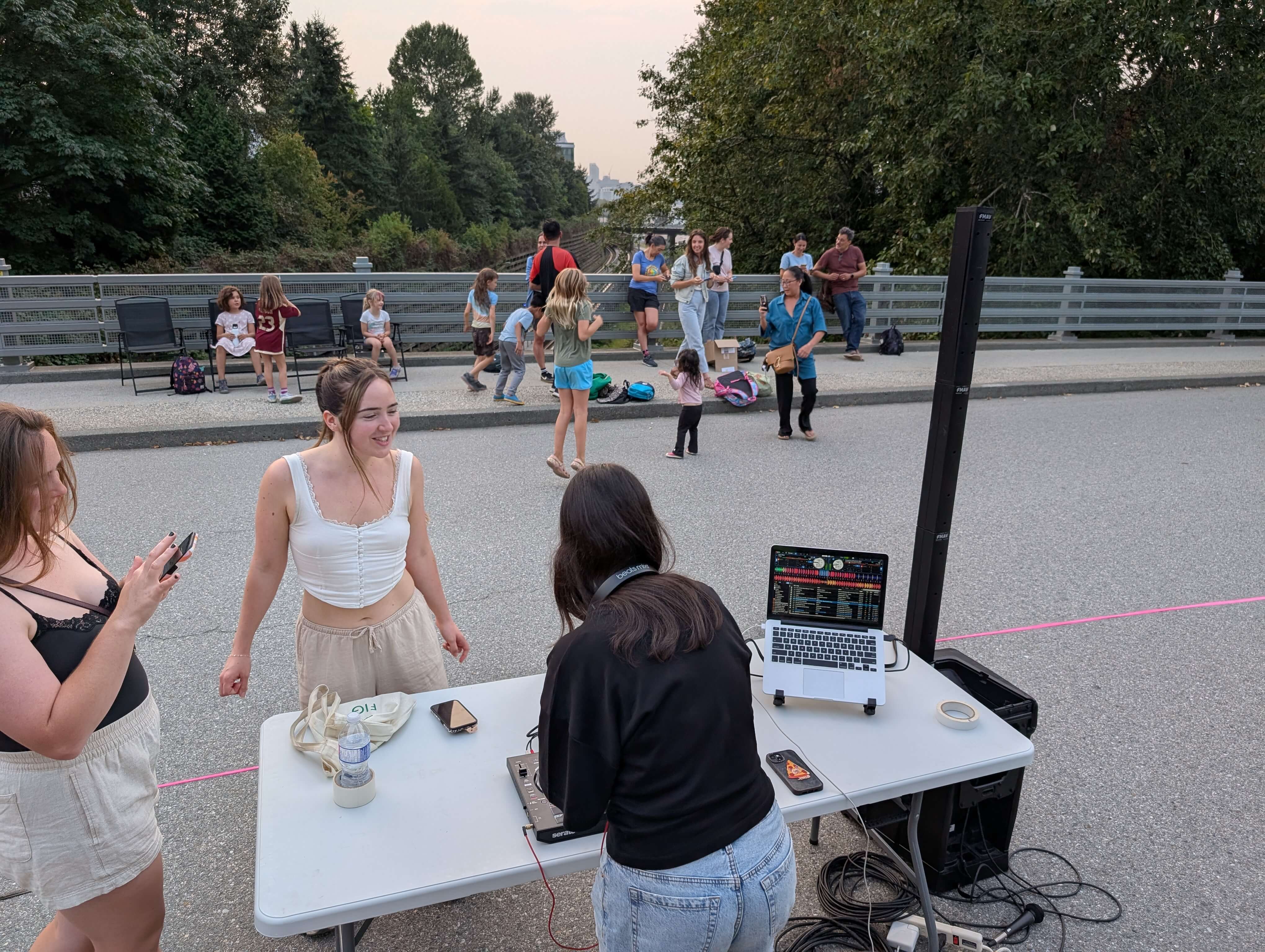 Photo of people enjoying street activities on Woodland Bridge.