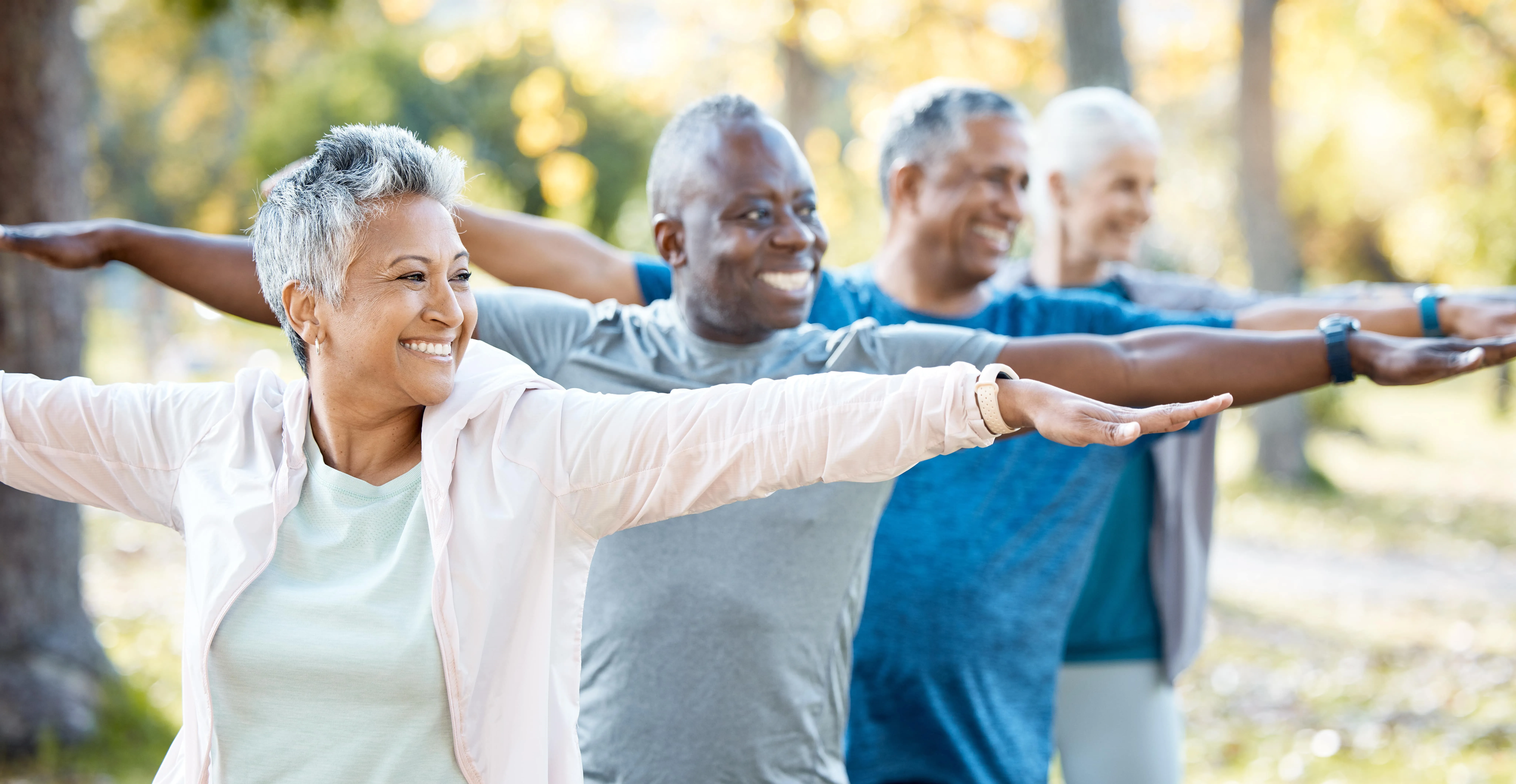people doing yoga outside stock photo