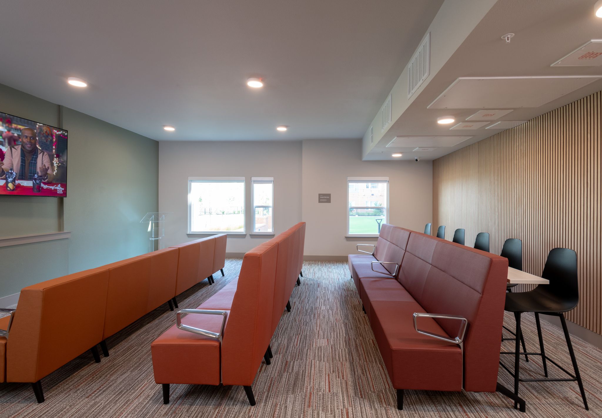 Theater room with seats and tv