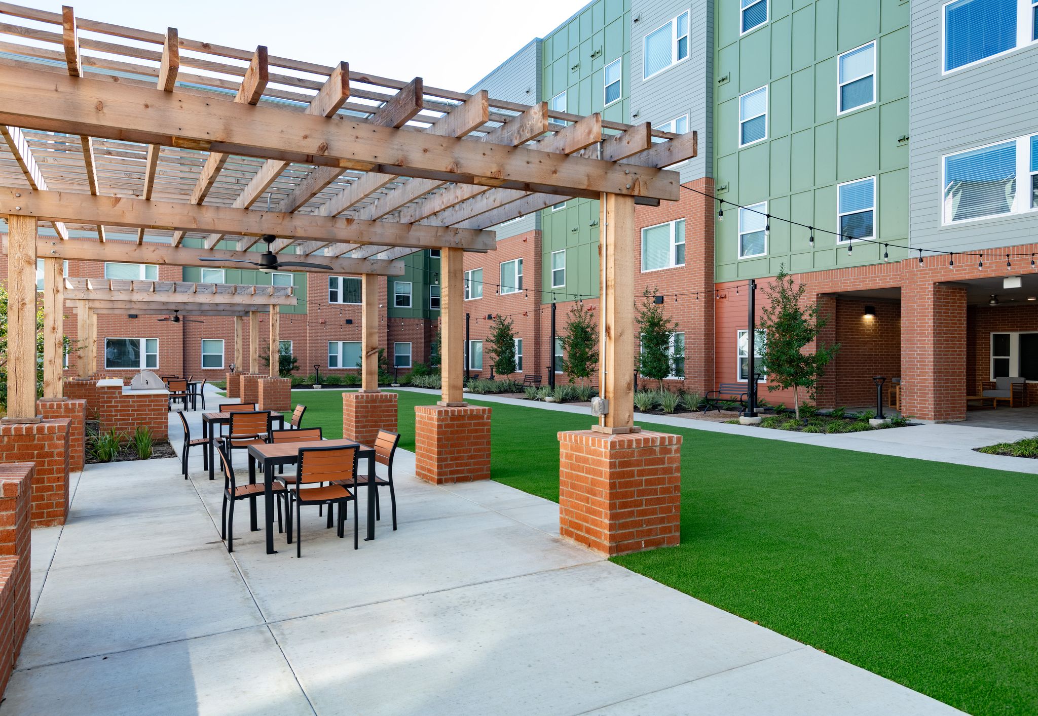 Courtyard with tables and chairs under cabana