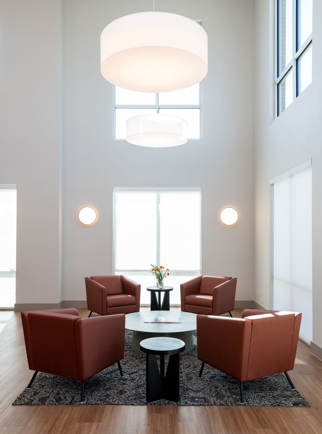 Ennis lobby seating area with sofas and chandelier 