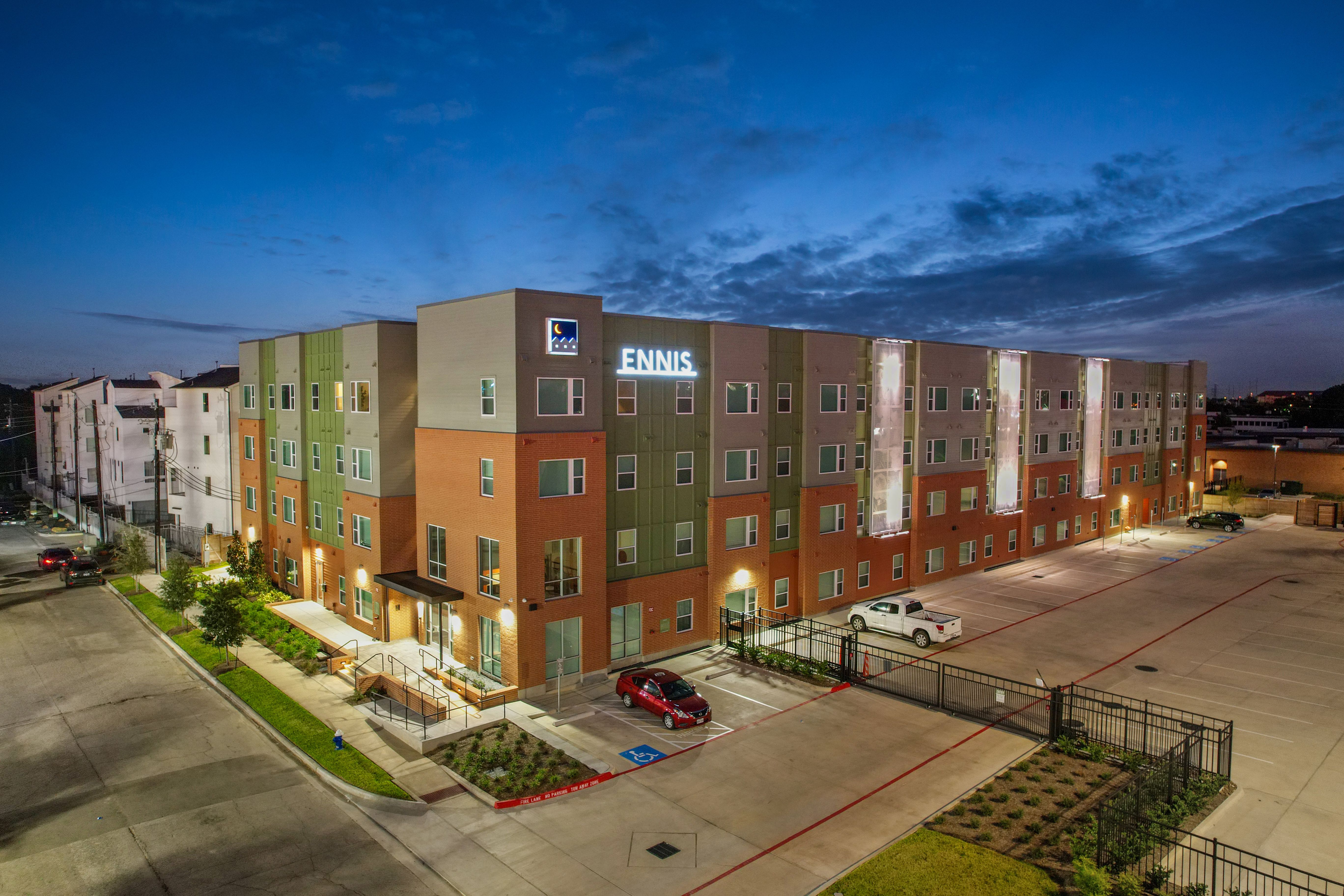 Birds eye aerial view of ennis exterior at night 