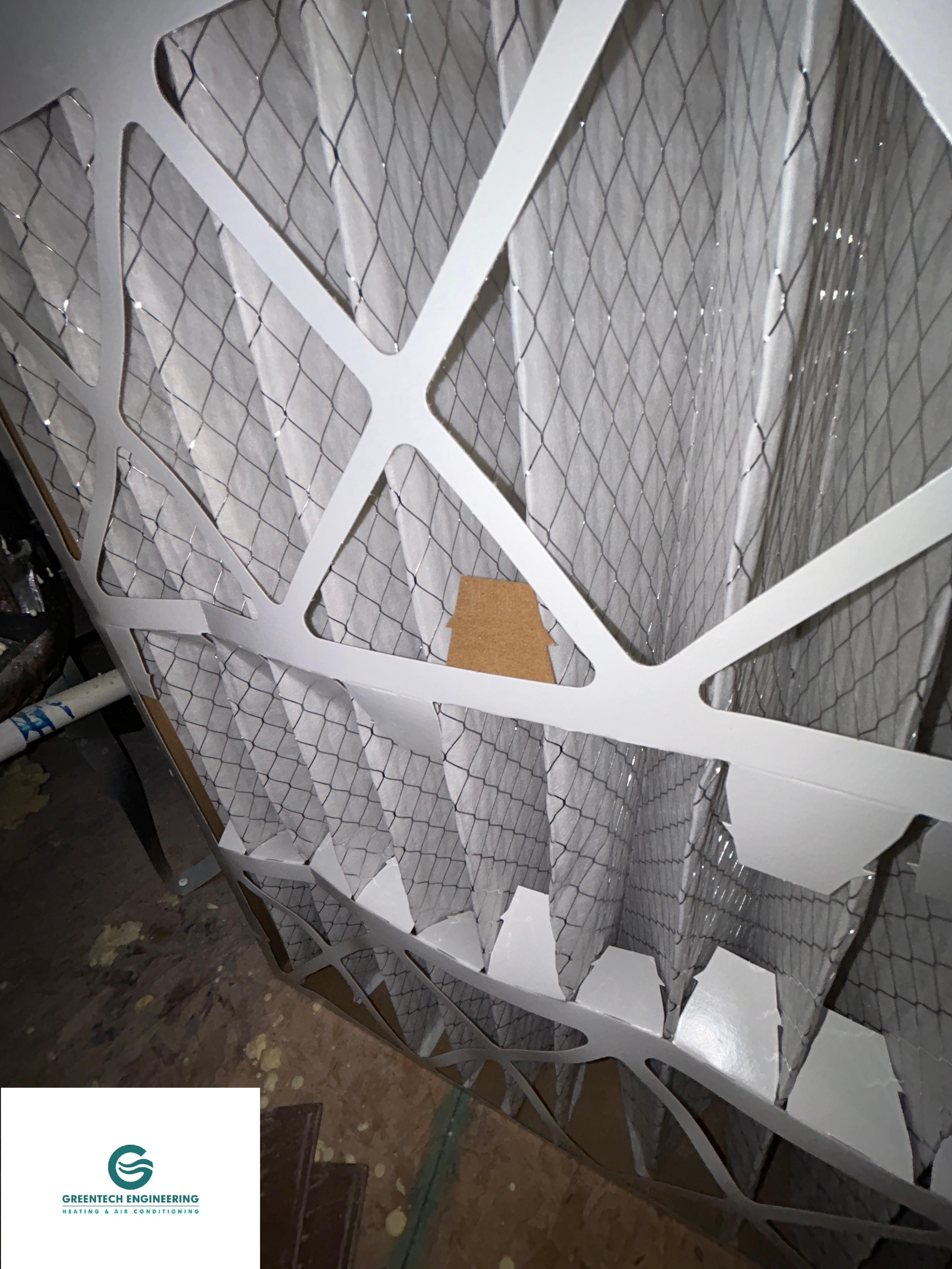 Severely clogged indoor HVAC air filter causing airflow restriction in a Grand Prairie home.