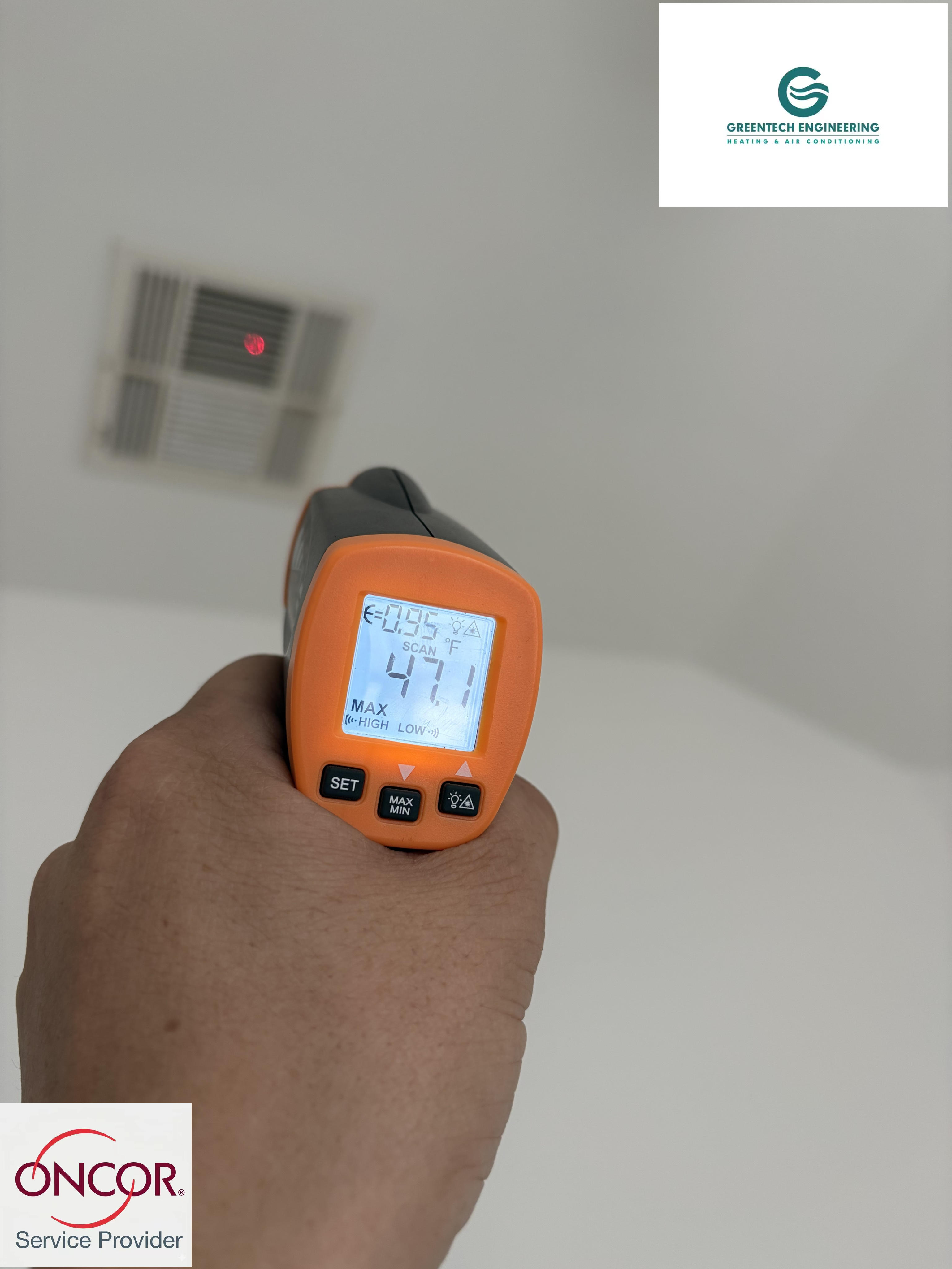 Greentech Engineering technician verifying freezing cold 47 degree air from an HVAC vent after a successful AC replacement in Grand Prairie, TX.