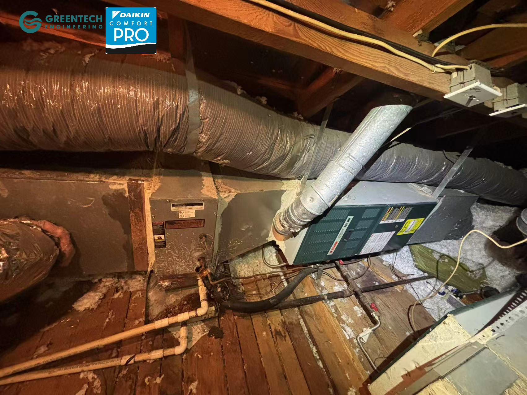 The old, inefficient Trane indoor gas furnace prior to being replaced and responsibly recycled by Greentech Engineering.