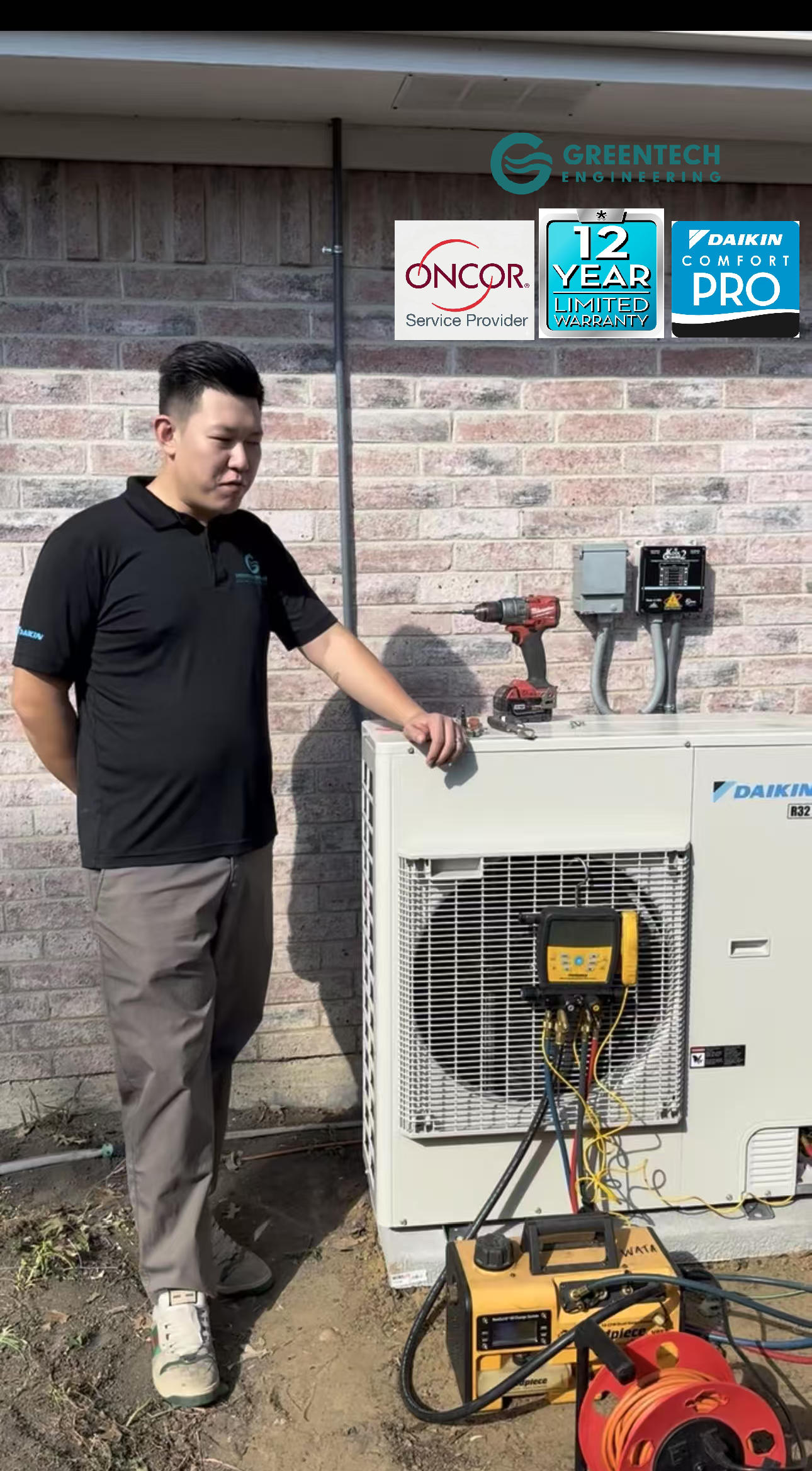 Greentech Engineering CTO Lucas Chen standing next to a newly installed Daikin Fit condenser in a Dallas side yard, supervising digital pressure testing with Fieldpiece gauges.