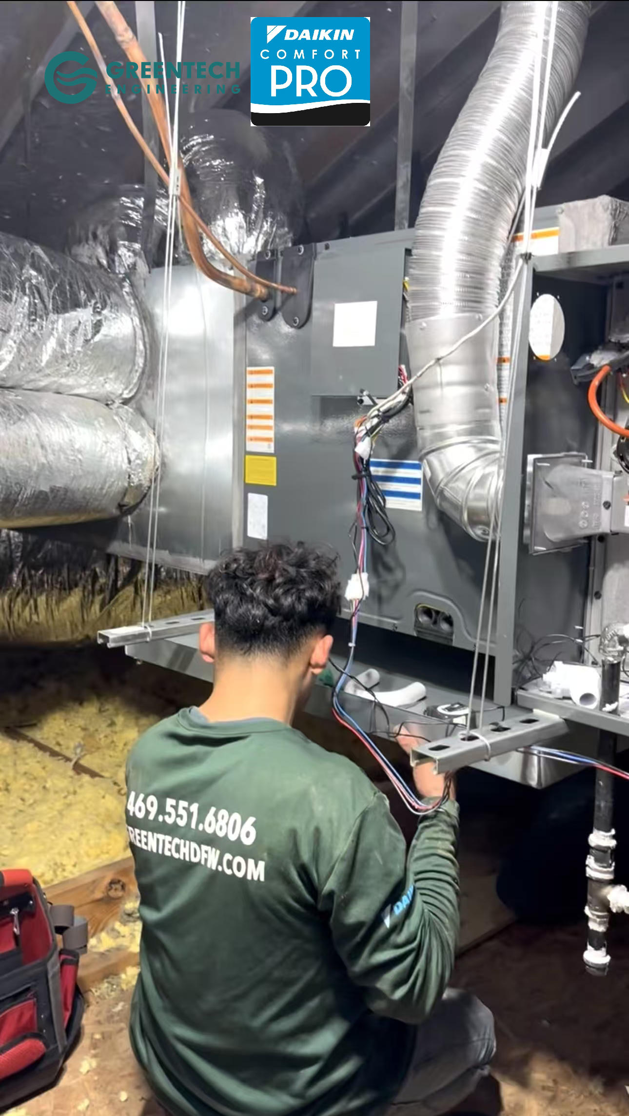 A Greentech Engineering HVAC technician carefully installing a brand new, custom-fabricated metal supply plenum in a Dallas attic to improve static pressure.