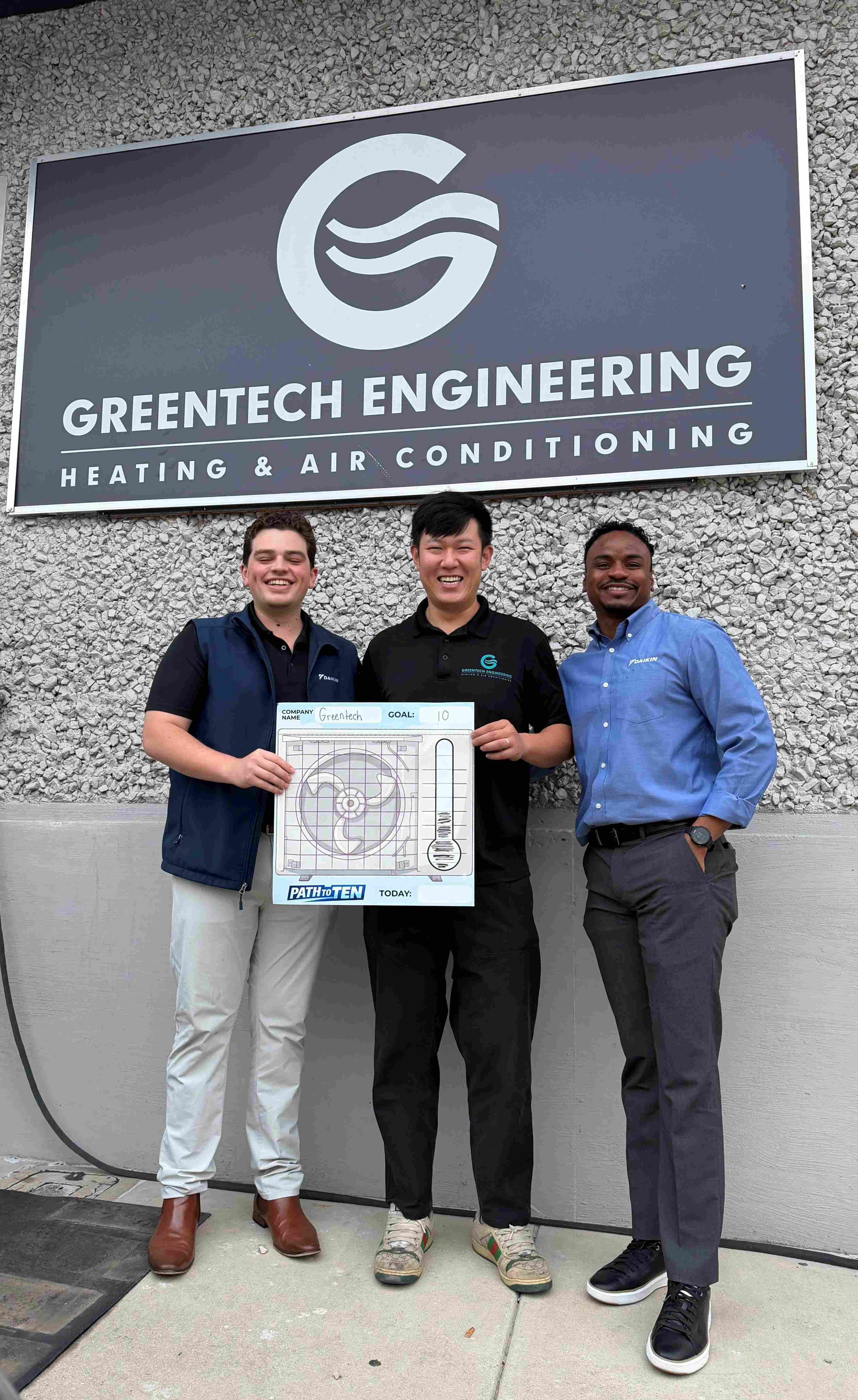 The Daikin Dallas regional team, including Von and Thomas, visiting the Greentech Engineering headquarters and posing with CTO Lucas in front of Greentech Engineering Office.