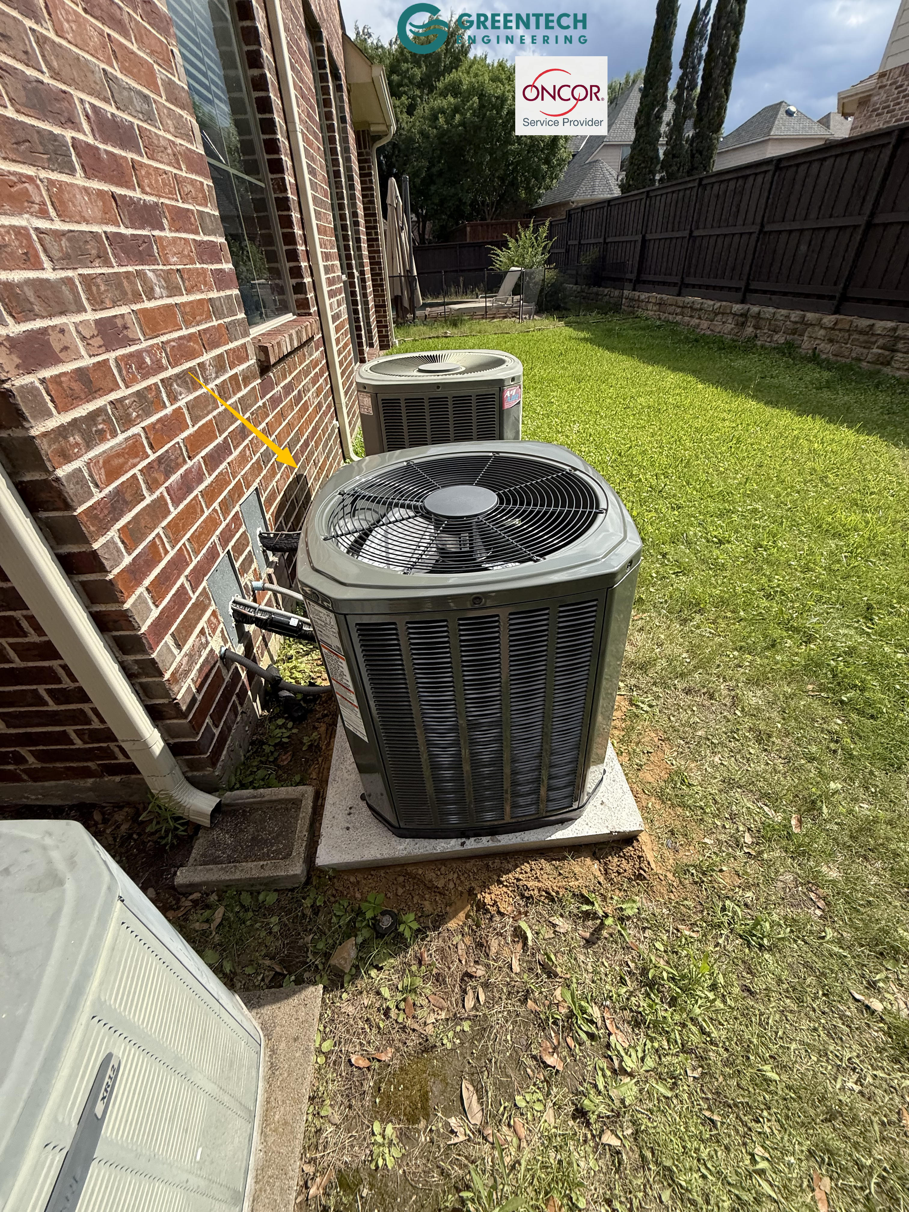 A second newly installed Trane 3-Ton condenser placed cleanly along the brick exterior wall of a two-story home.
