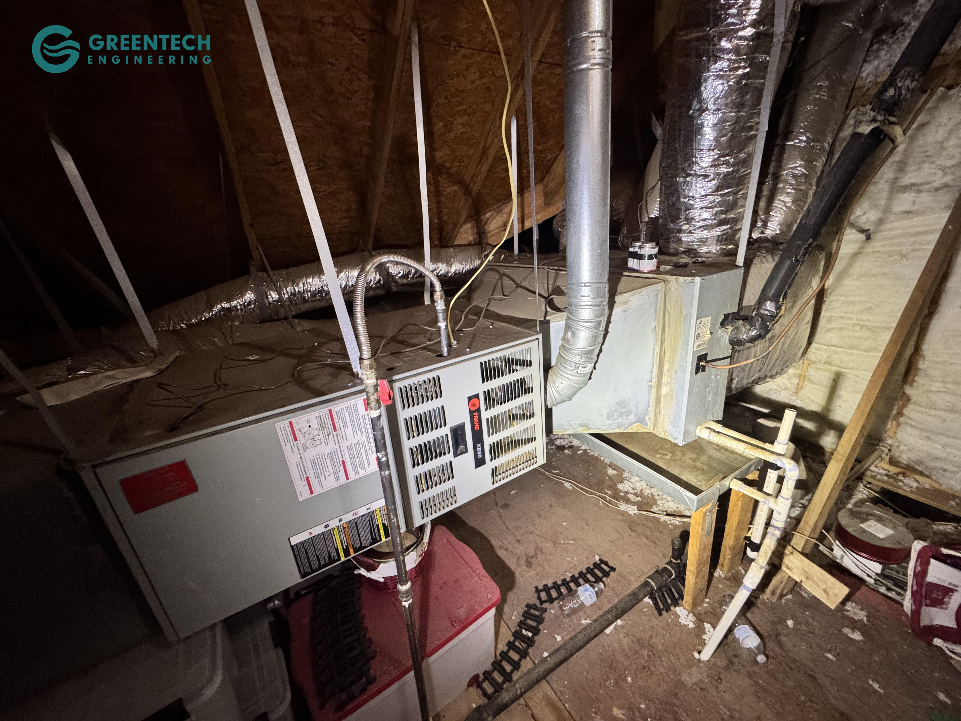An older, inefficient Trane indoor furnace and coil system with failing ductwork connections and poor suspension in an Allen, TX attic.