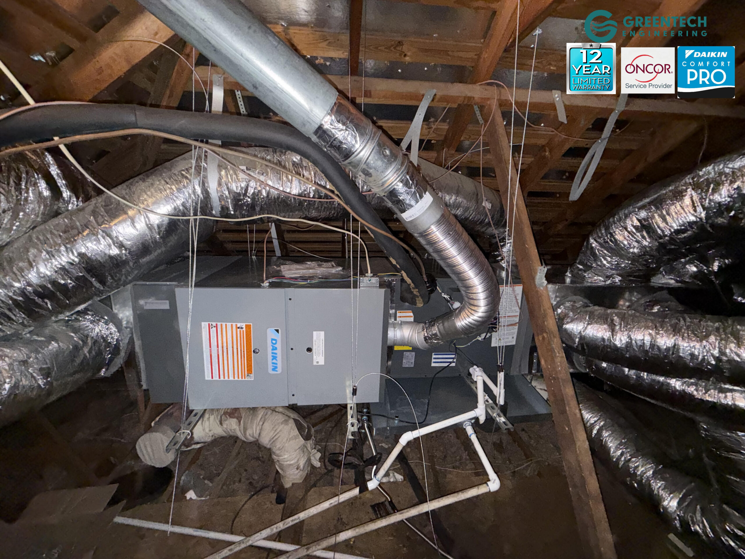 A flawlessly installed Daikin communicating indoor system in a Dallas attic, featuring an all-aluminum evaporator coil, a Clean Comfort 4-inch media filter platform, and custom-fabricated insulated metal plenums.
