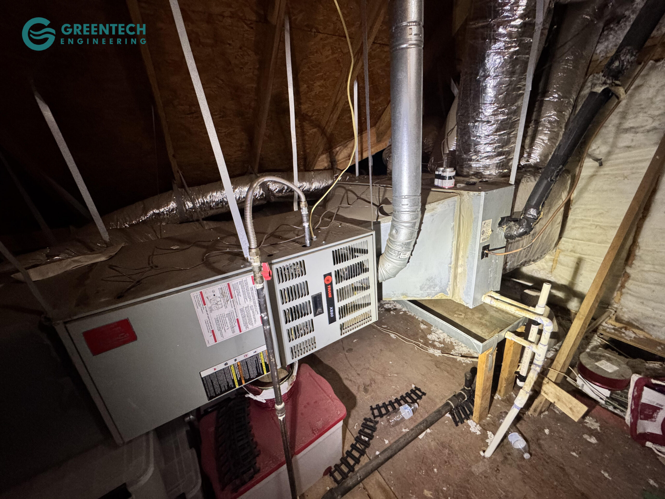 An older, inefficient Trane indoor furnace and coil system with failing ductwork connections and poor suspension in an Allen, TX attic.