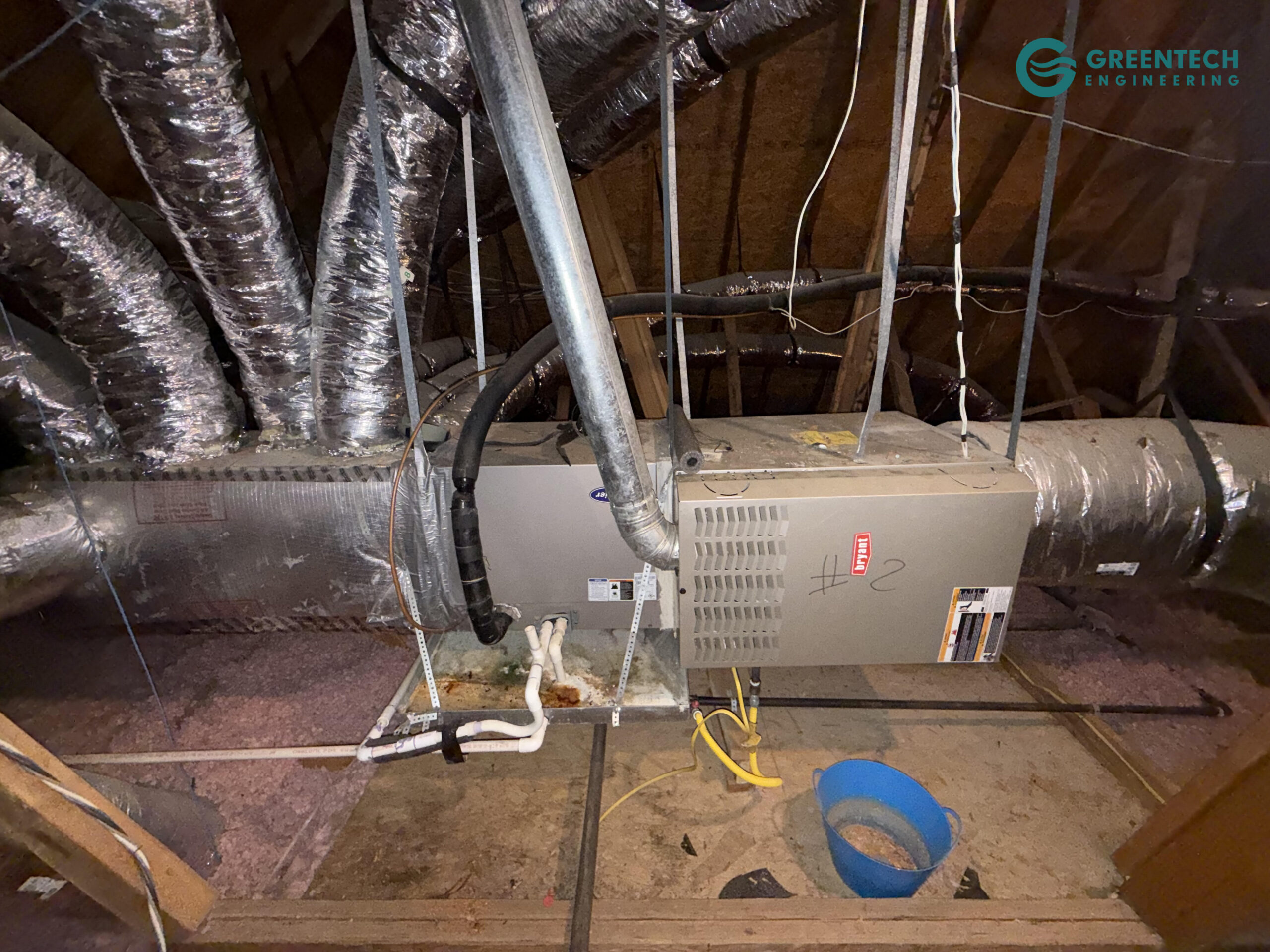 An old, inefficient legacy indoor HVAC unit and degraded supply plenum in a Texas attic.