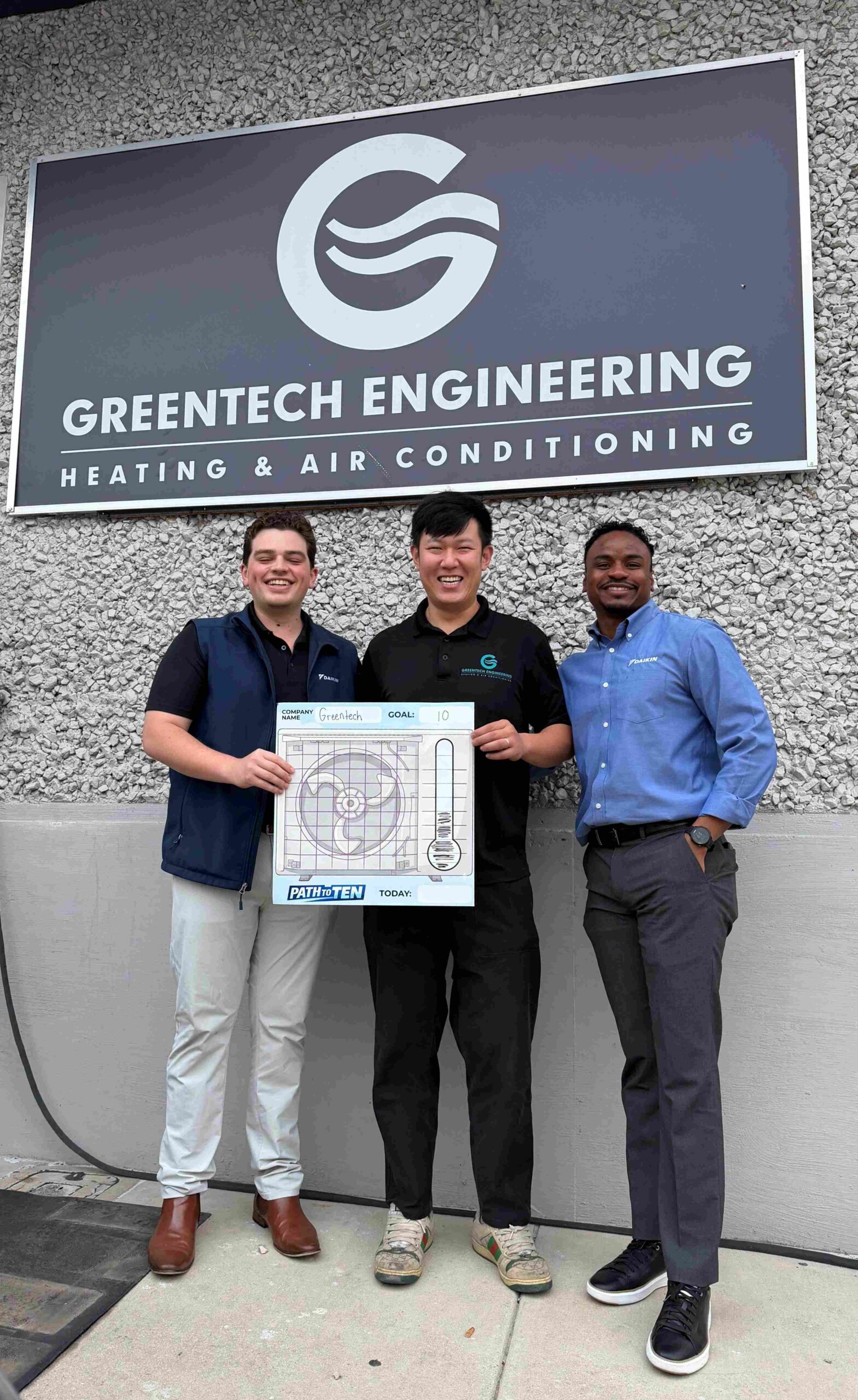 The Daikin Dallas regional team, including Von and Thomas, visiting the Greentech Engineering headquarters and posing with CTO Lucas in front of Greentech Engineering Office.