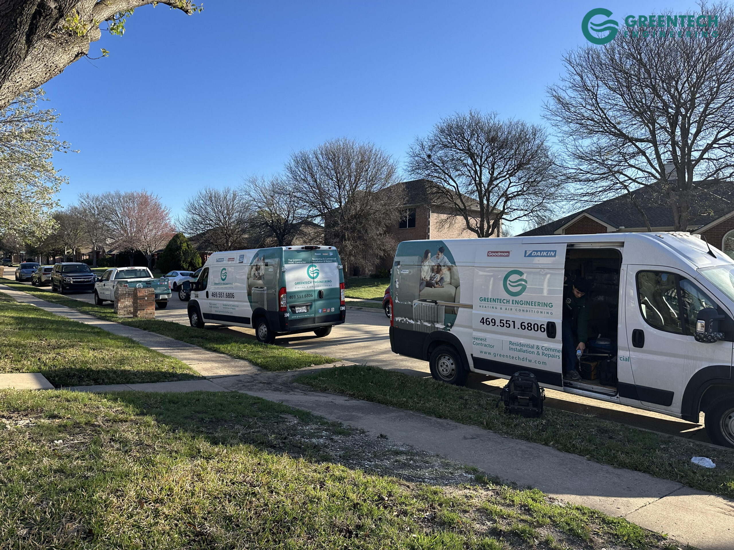 Greentech Engineering HVAC vans parked on a residential street in Allen, Texas.