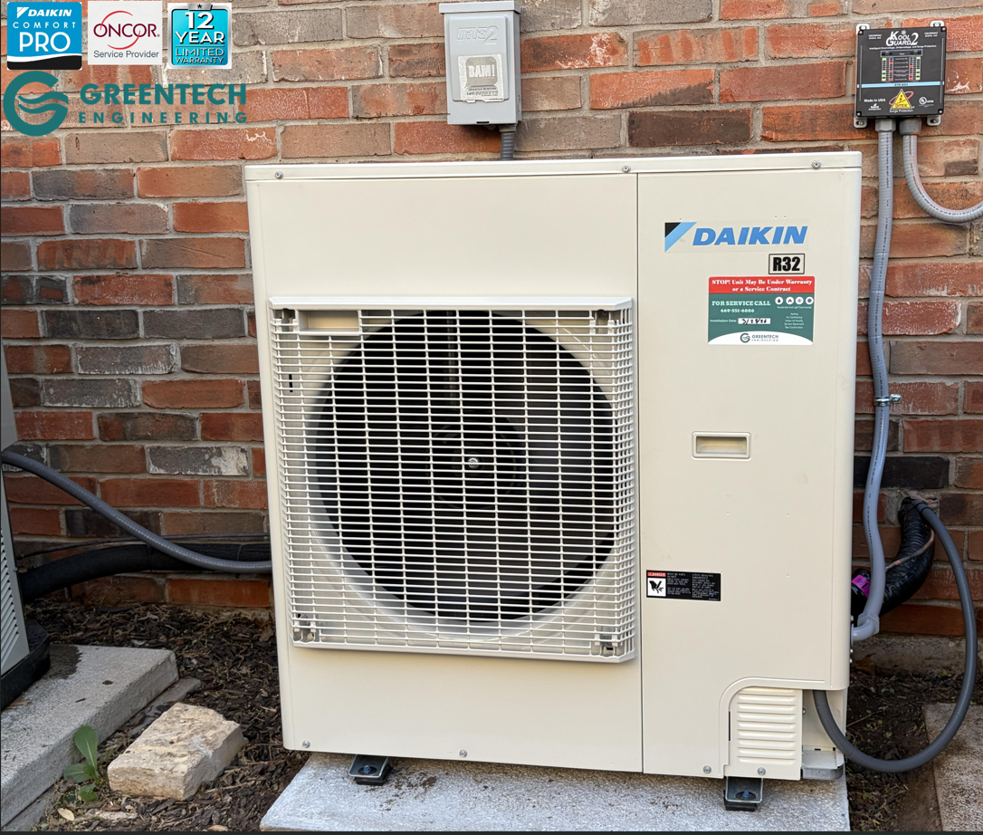 A sleek, side-discharge Daikin Fit variable-speed heat pump condenser installed cleanly outside a brick home in North Dallas, Texas.