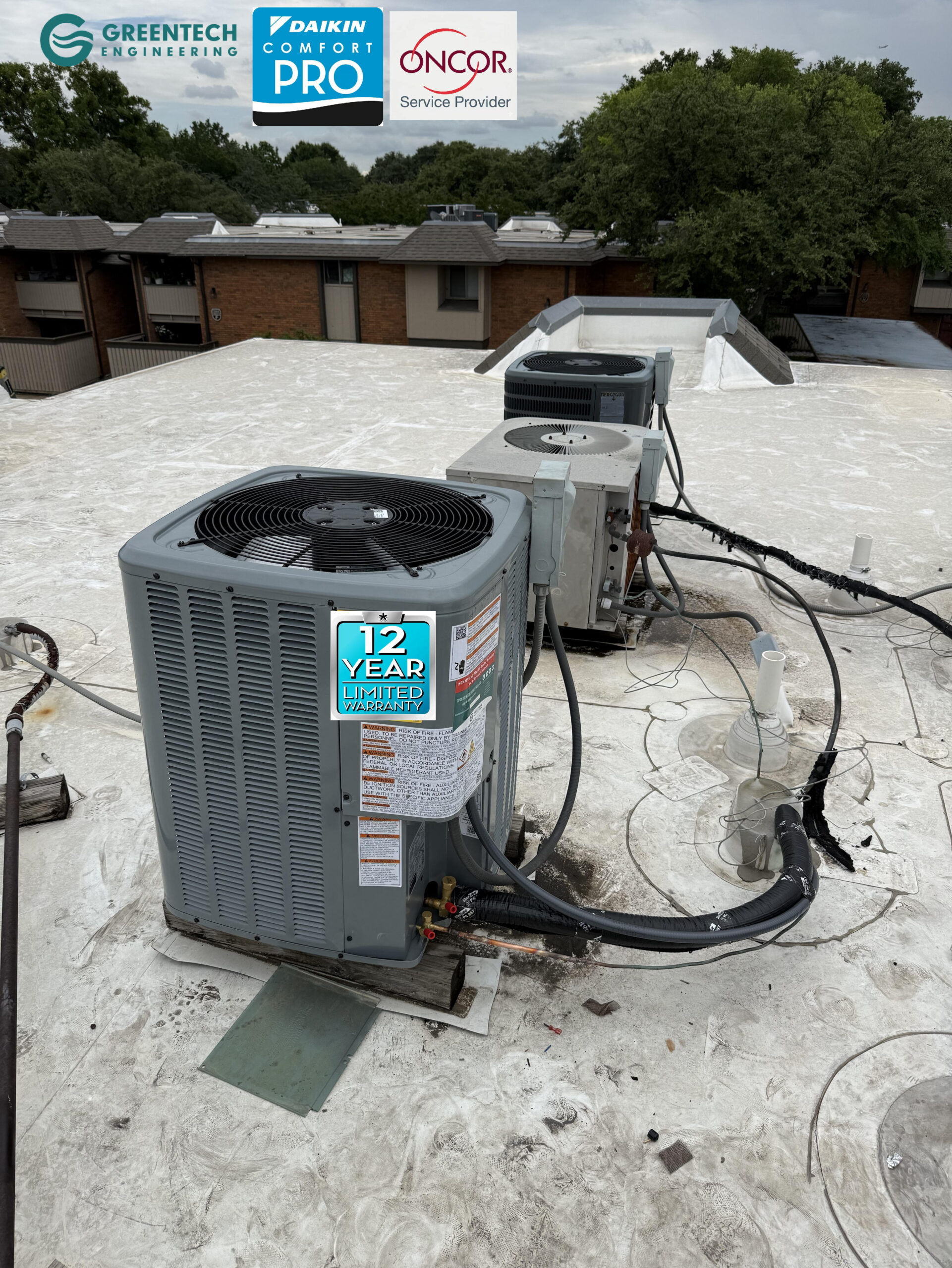 A pristine, newly installed Daikin 2-Ton air conditioning condenser sitting perfectly leveled on a Dallas apartment rooftop alongside other units.