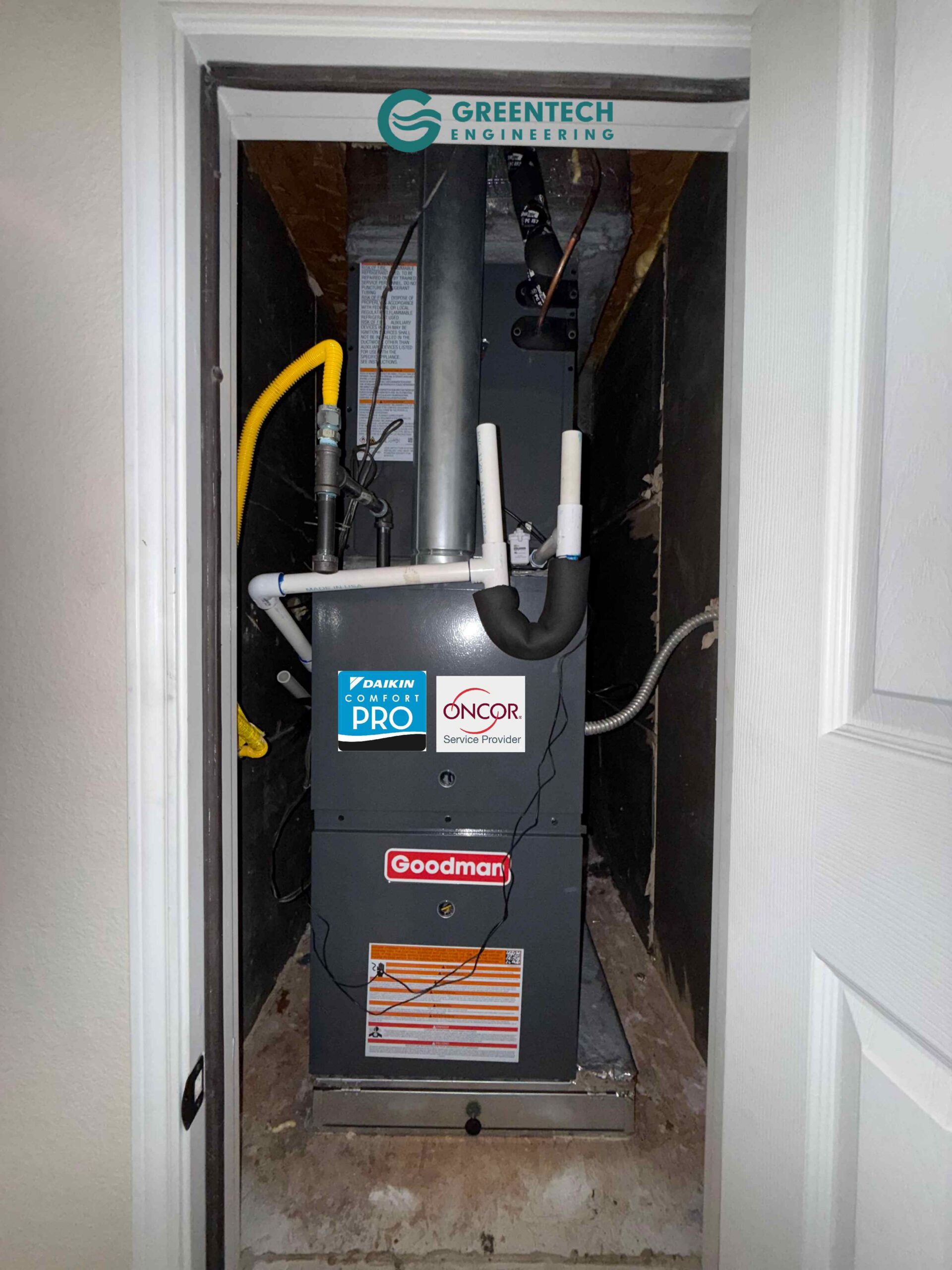 A brand new Goodman 80% AFUE gas furnace and Daikin cased evaporator coil installed cleanly in a Fort Worth residential utility closet, featuring new PVC drain lines and gas piping.