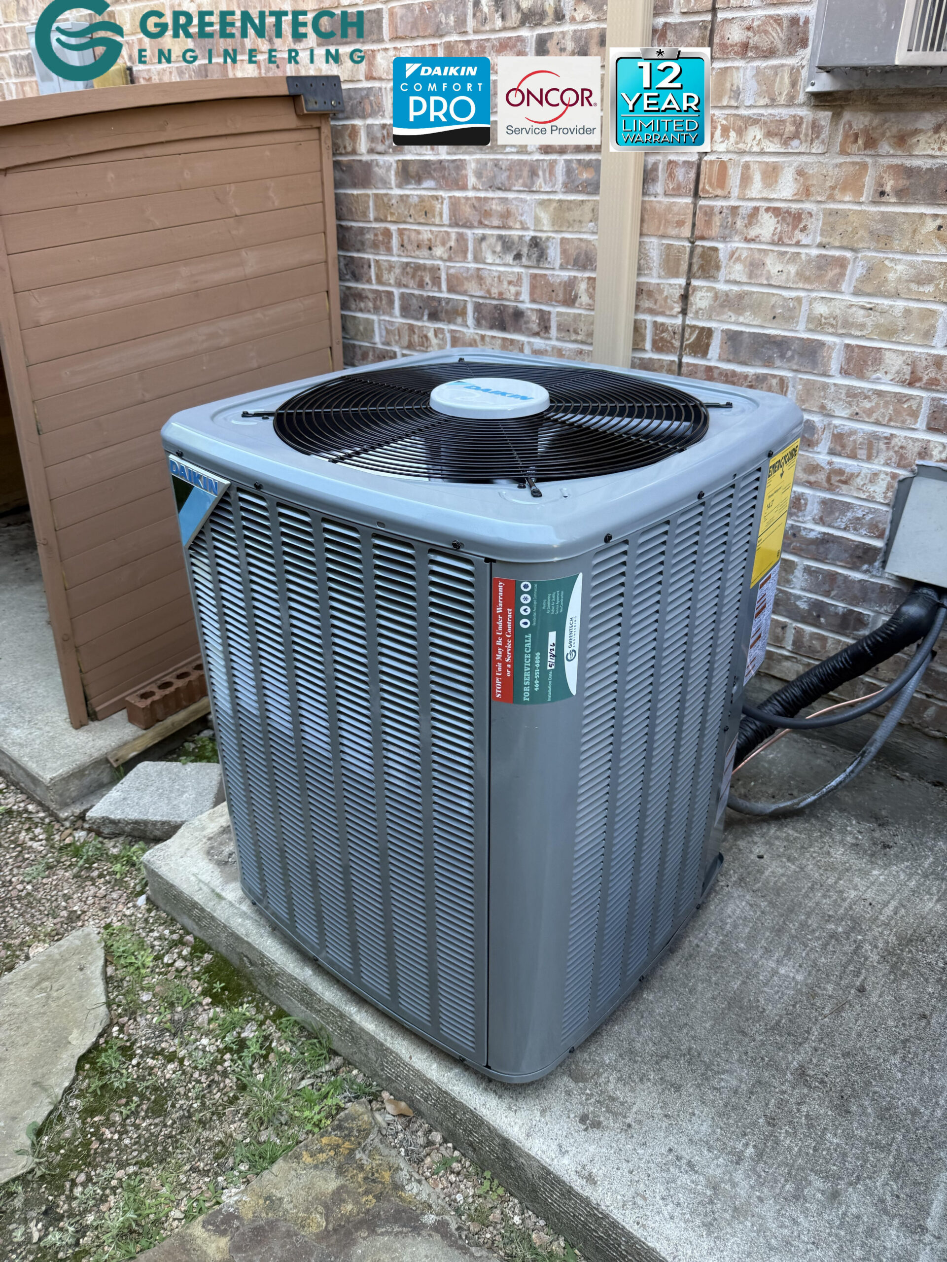 A close-up view of a newly installed Daikin air conditioning condenser featuring the Daikin Comfort Pro badge and energy guide sticker.