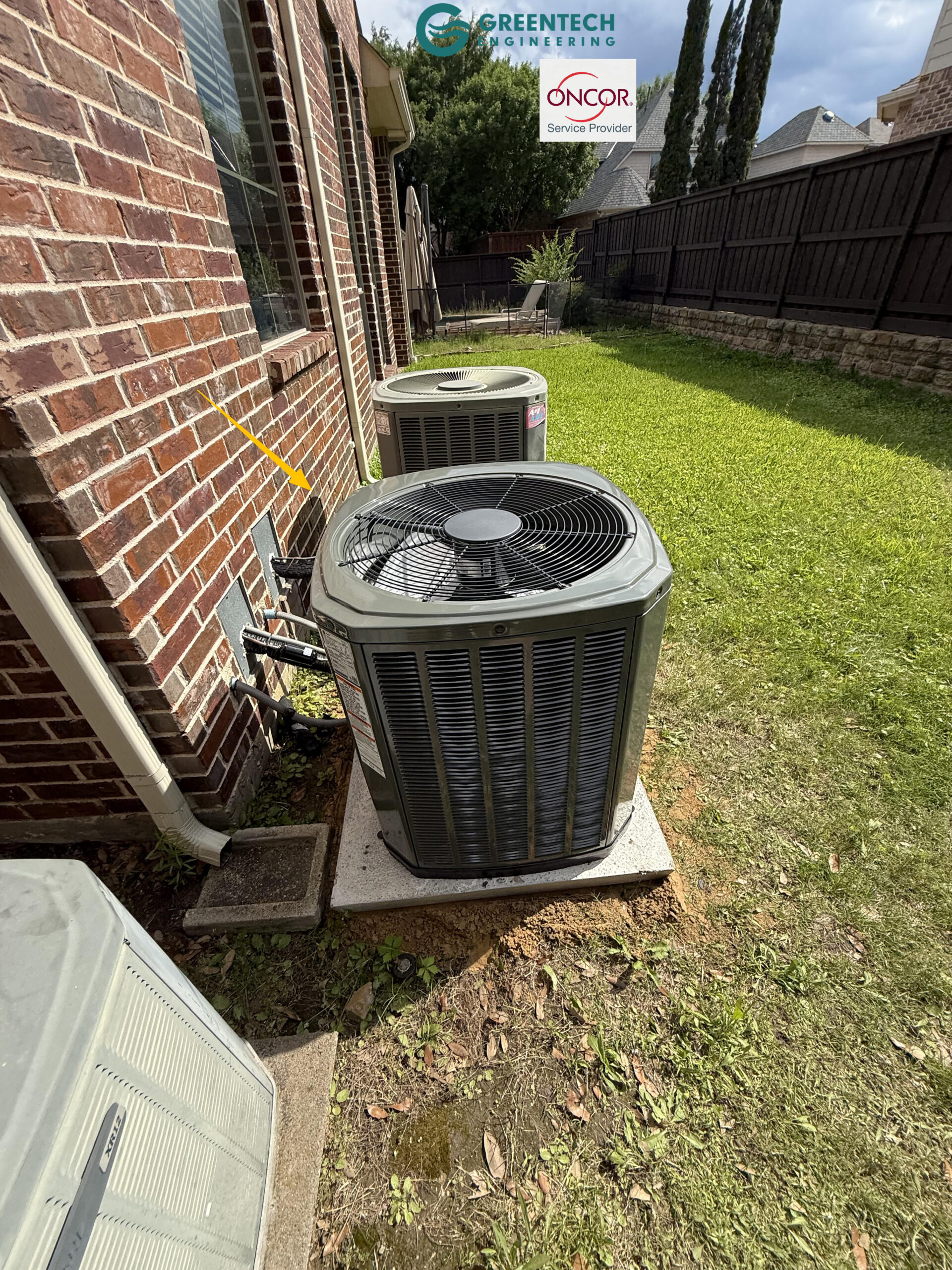 A second newly installed Trane 3-Ton condenser placed cleanly along the brick exterior wall of a two-story home.