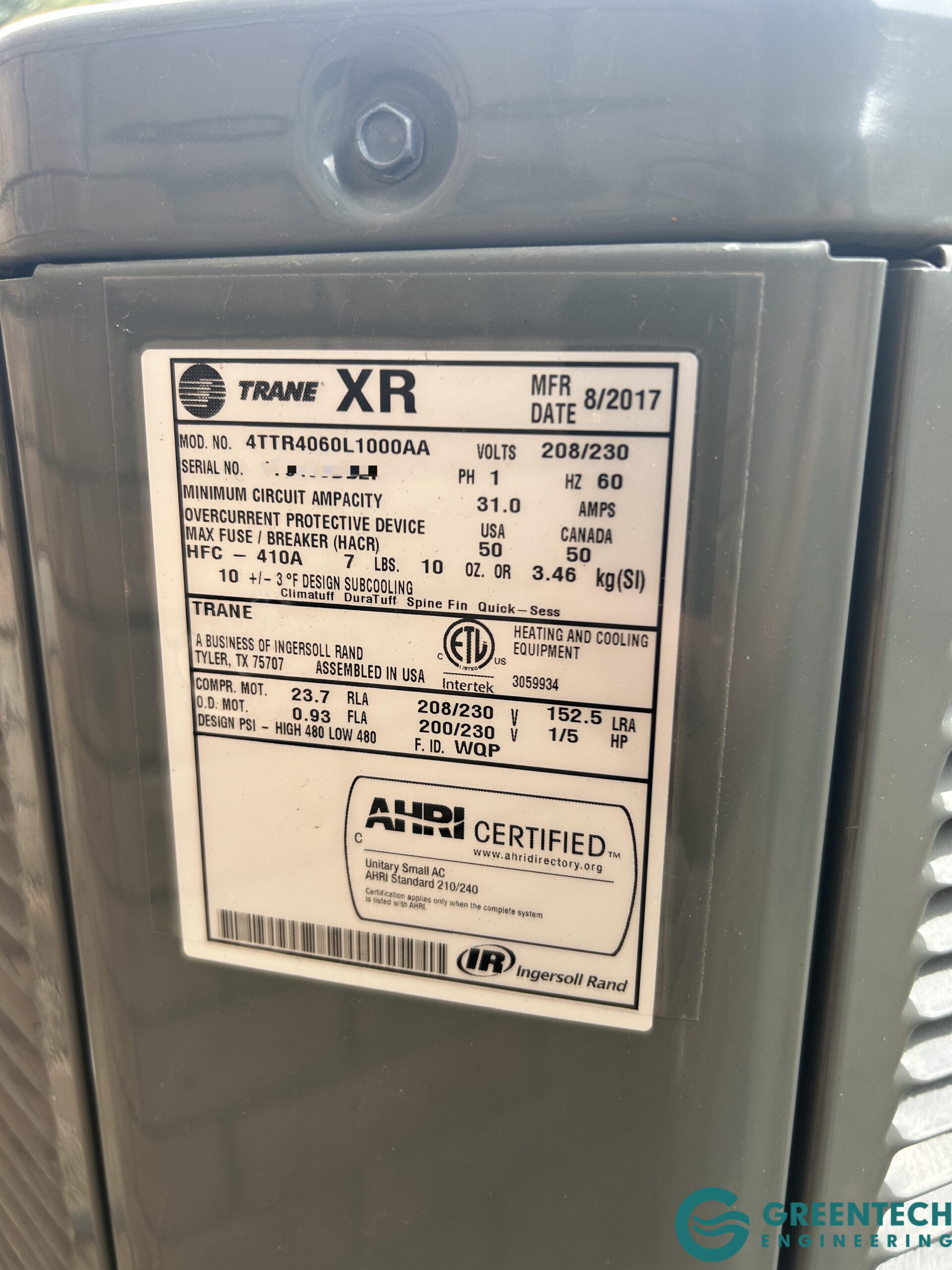 Data plate of the old Trane 5-Ton HVAC unit showing technical specifications.