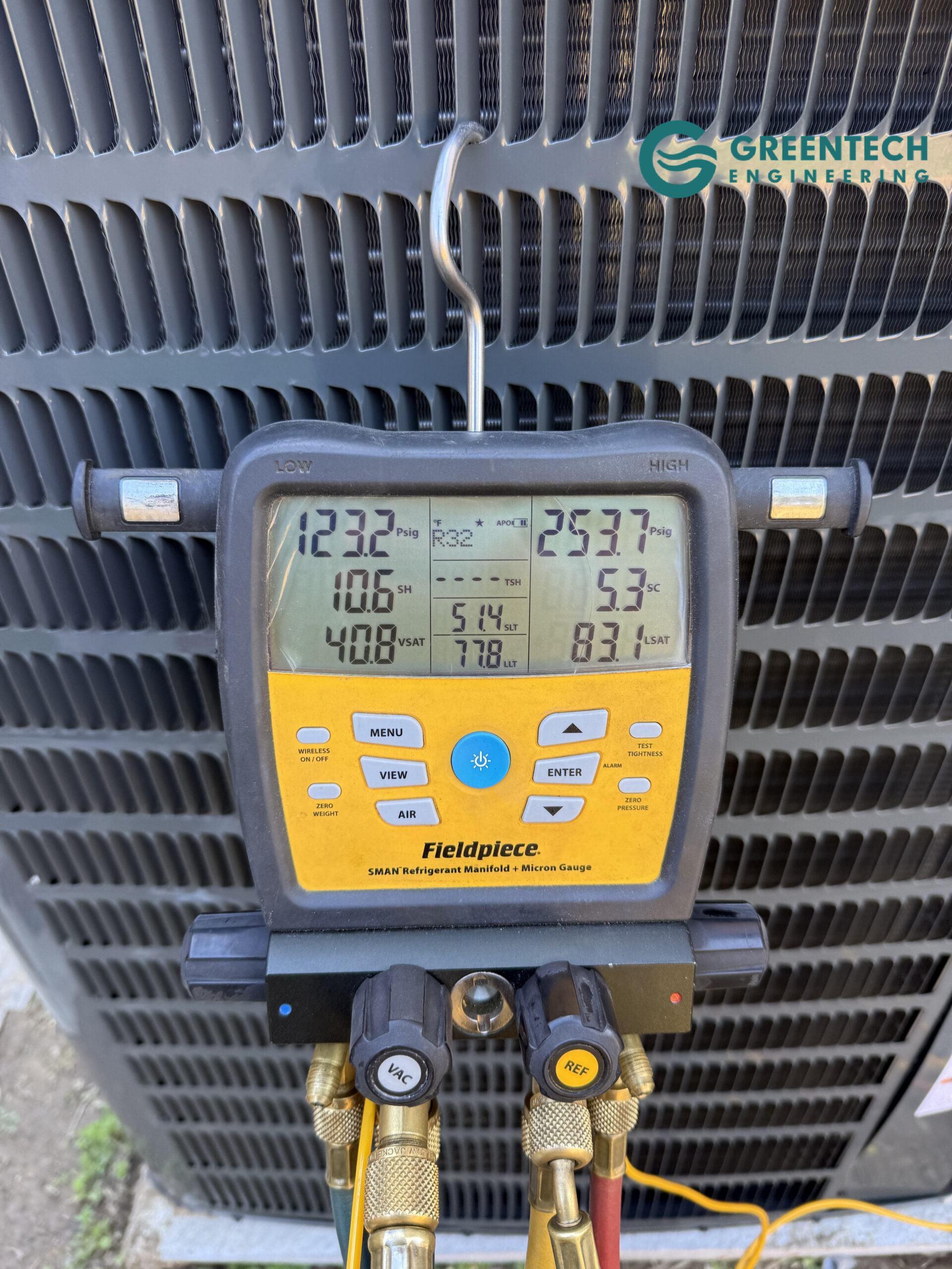Fieldpiece digital manifold gauges measuring subcooling and superheat on a new HVAC installation.
