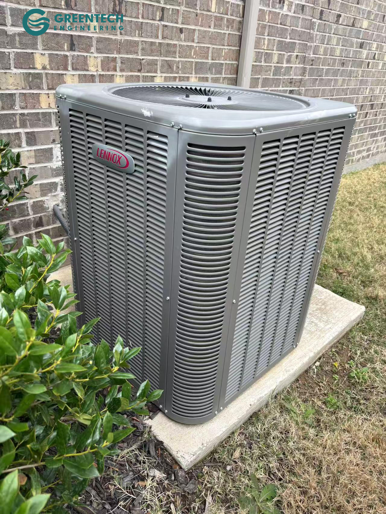 An aging, inefficient Lennox air conditioning condenser sitting on a concrete pad outside a brick home in Little Elm, TX.