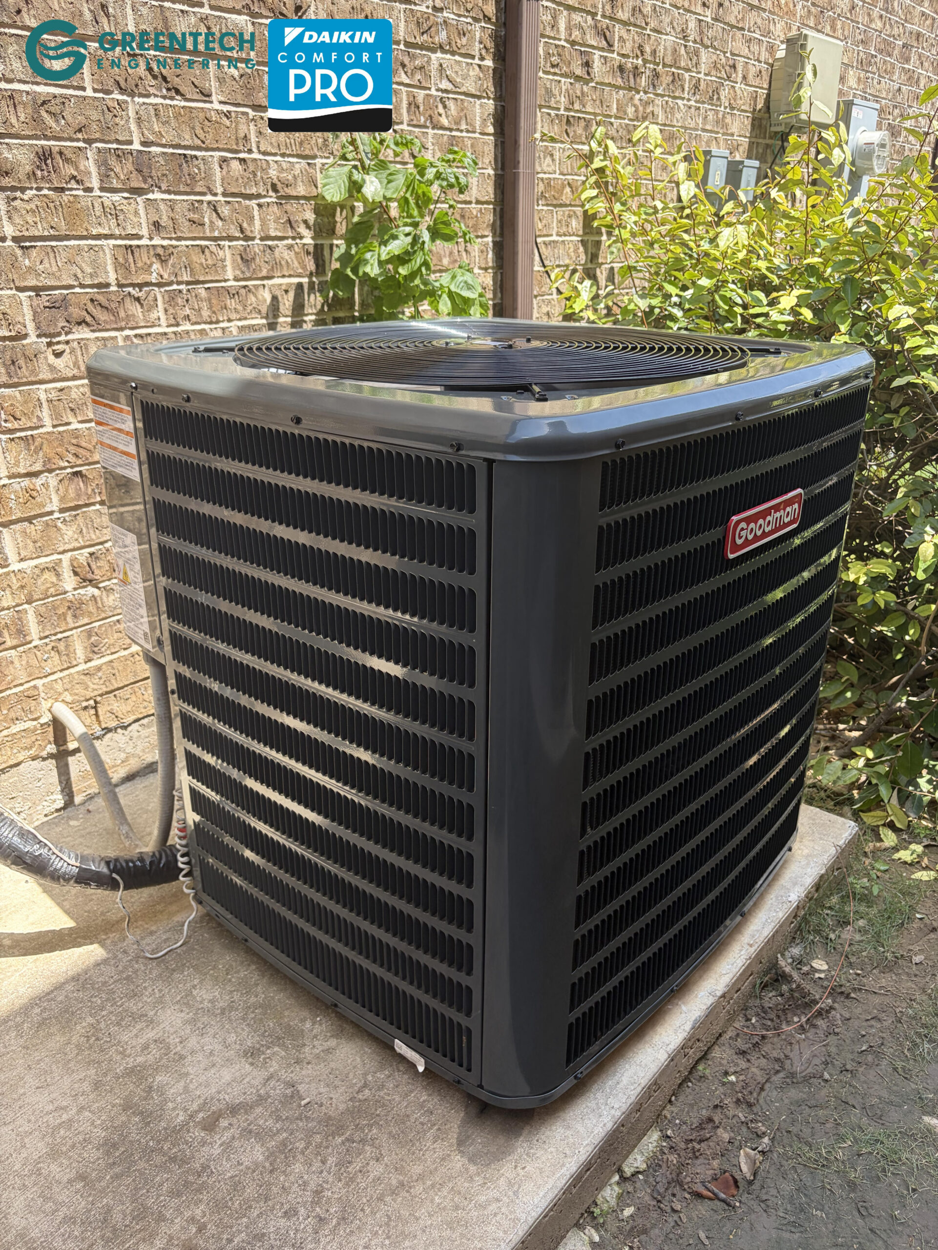  A pristine, energy-efficient Goodman 14.3 SEER2 air conditioning condenser installed on a leveled concrete pad in Little Elm, TX.