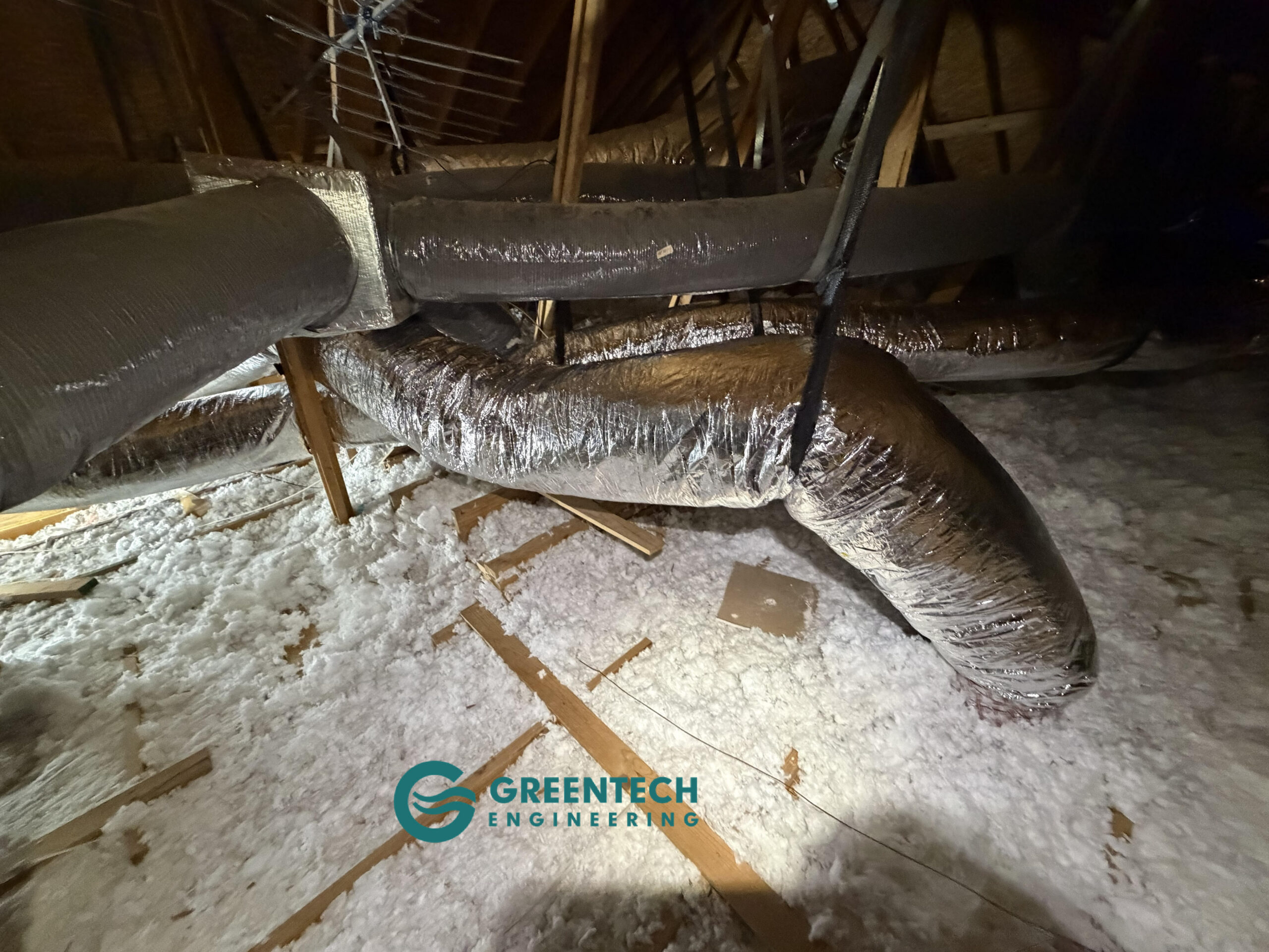 Newly installed insulated HVAC supply plenum in a residential attic