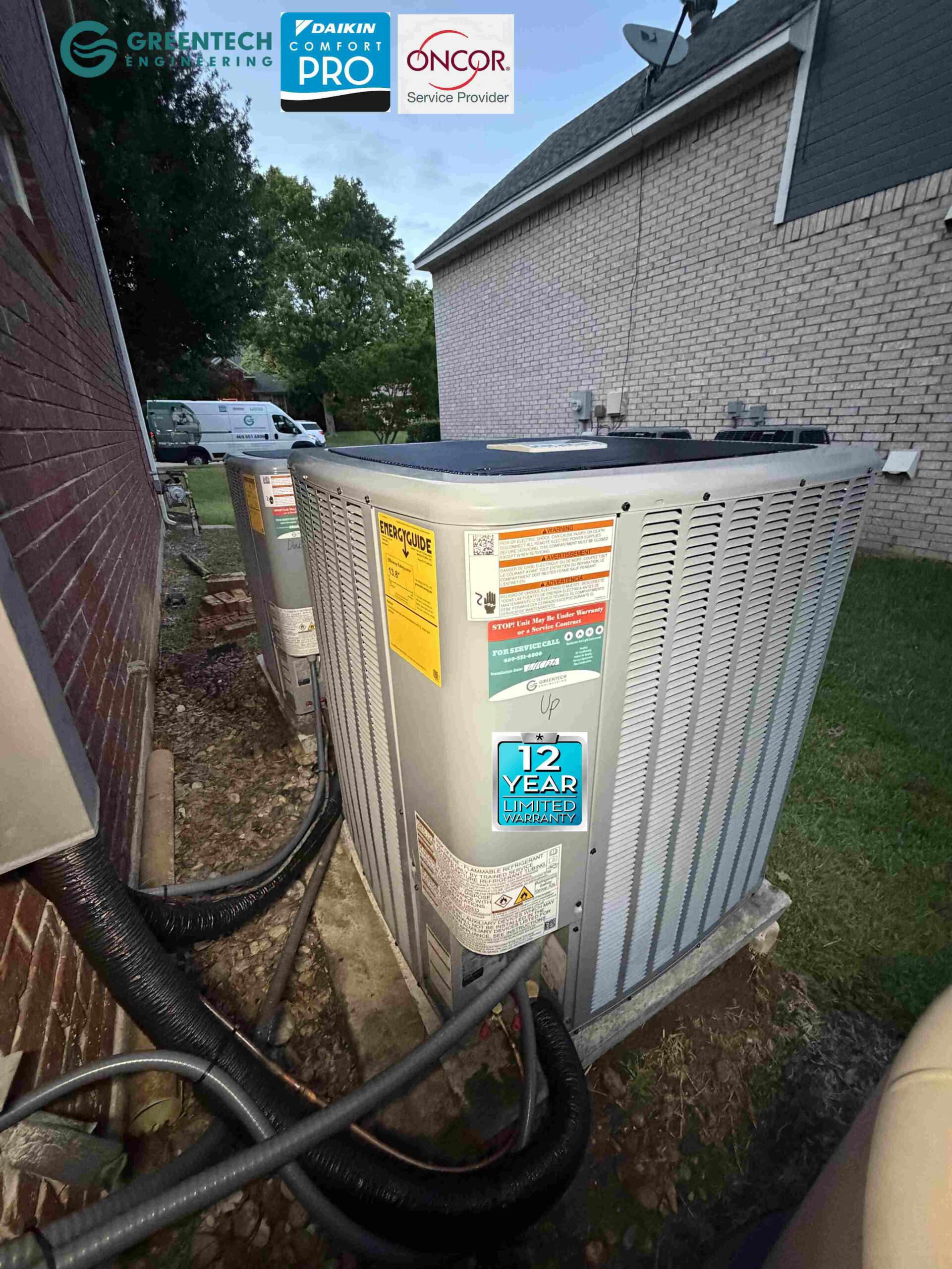Two pristine 17.2 SEER2 Daikin two-stage air conditioning condensers installed side-by-side on concrete pads in Plano, TX.