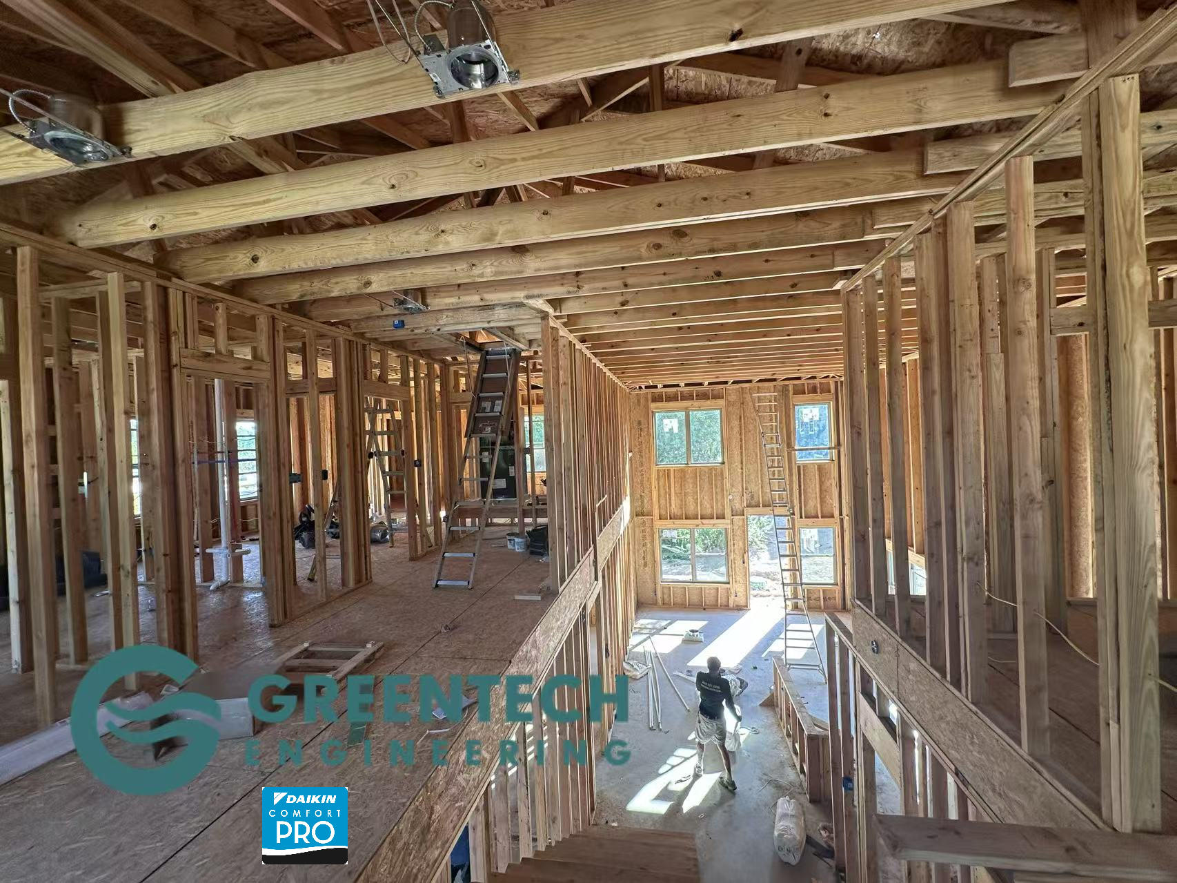 The interior timber framing of a new construction home in Plano, TX, showcasing the open ceiling joists before HVAC ductwork and rough-ins commence.